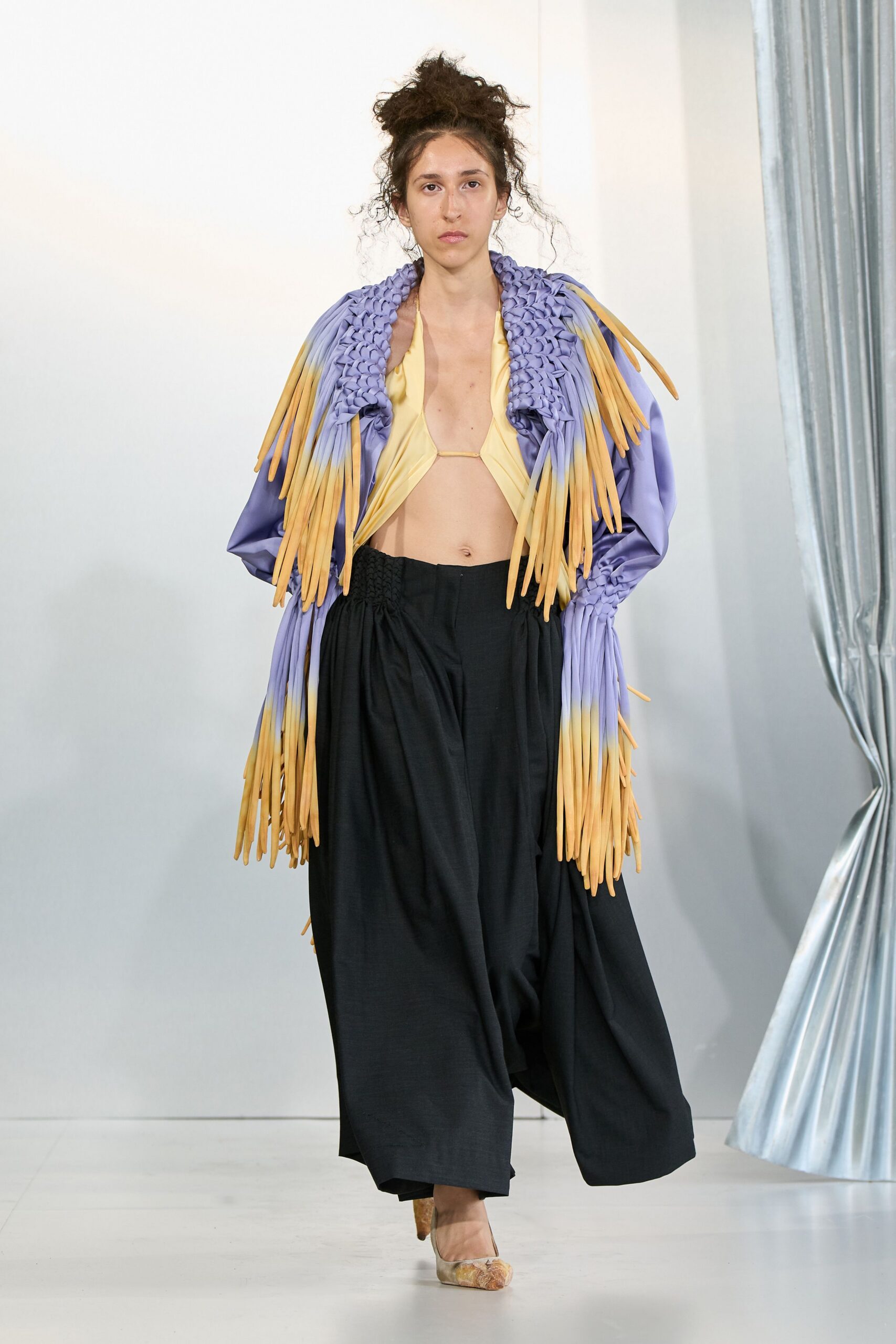 purple fringed jacket with yellow top