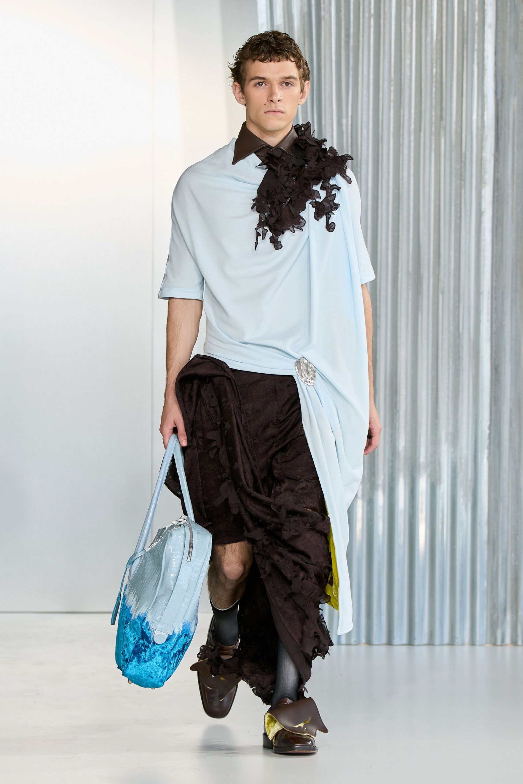light blue relaxed top with black layered skirt