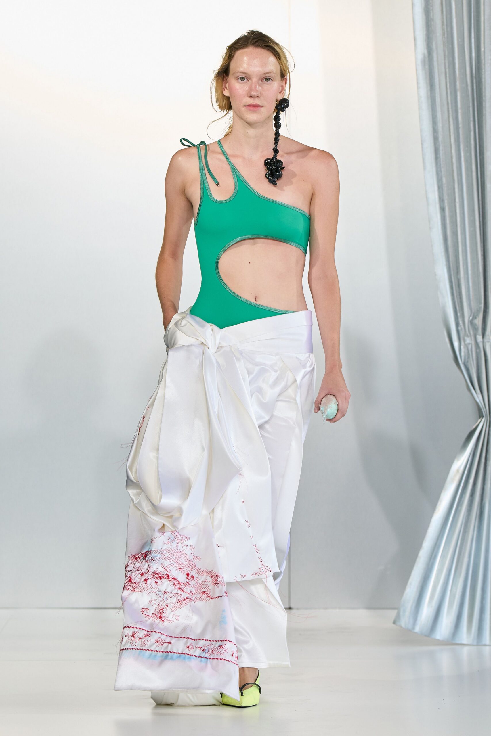 green swimsuit white pleated dress
