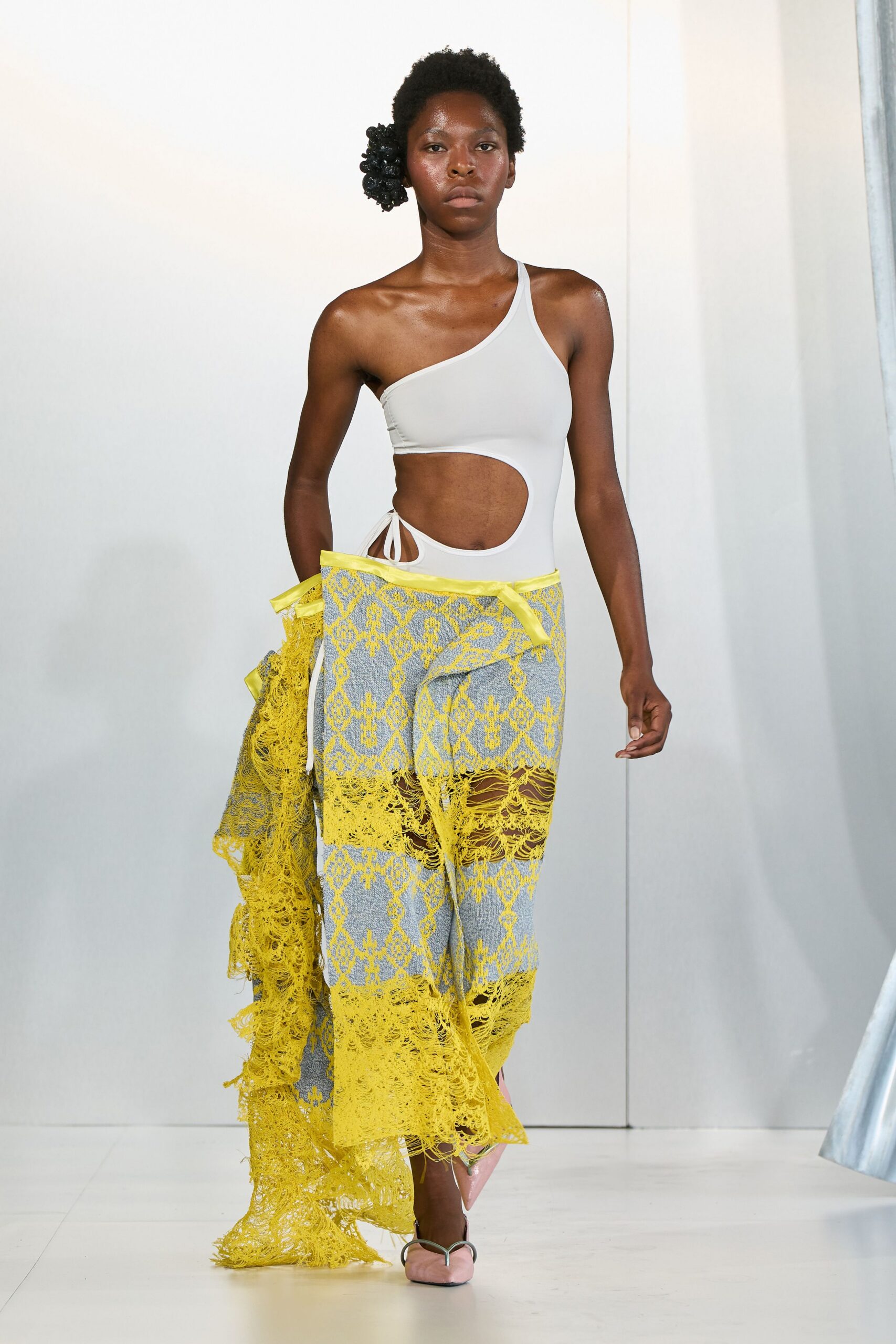 white bodysuit with yellow lace skirt
