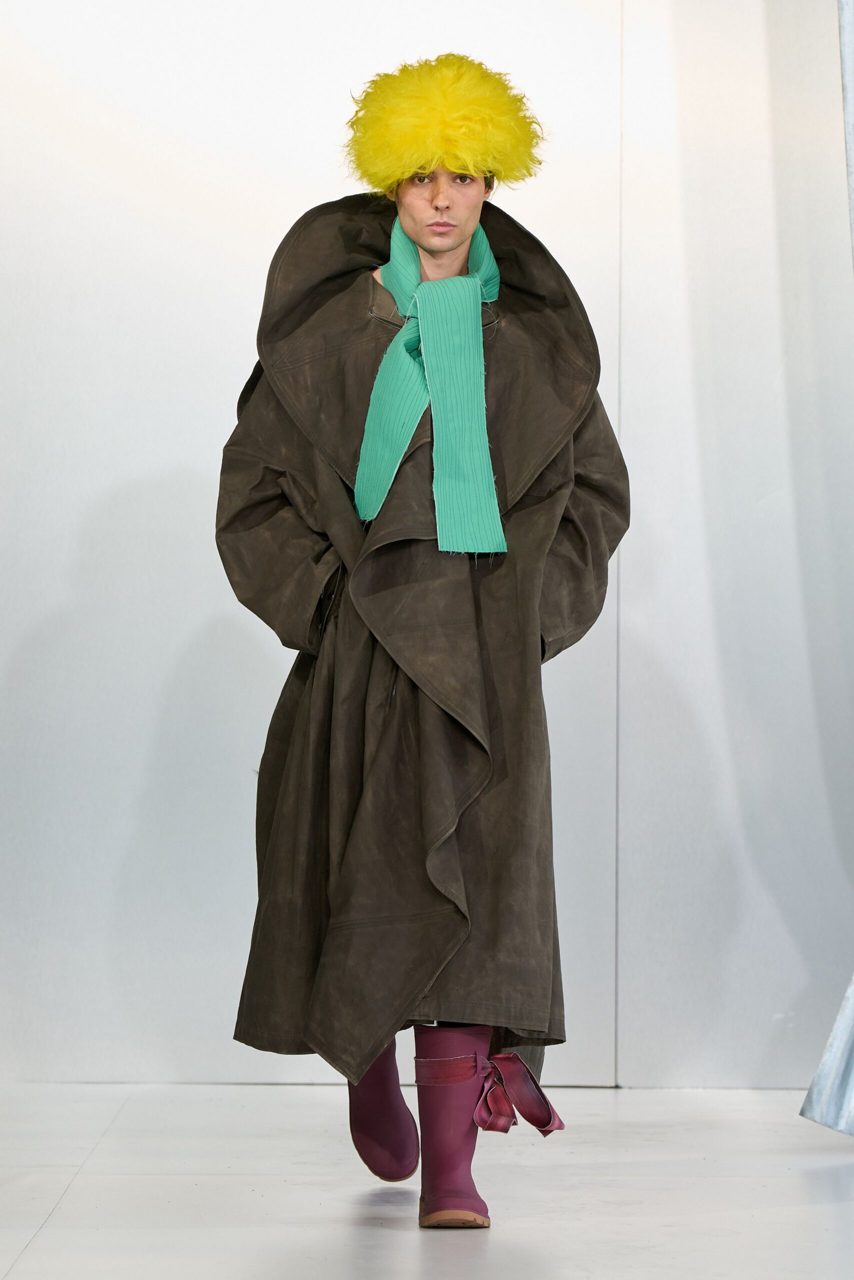 oversized brown leather coat with green scarf