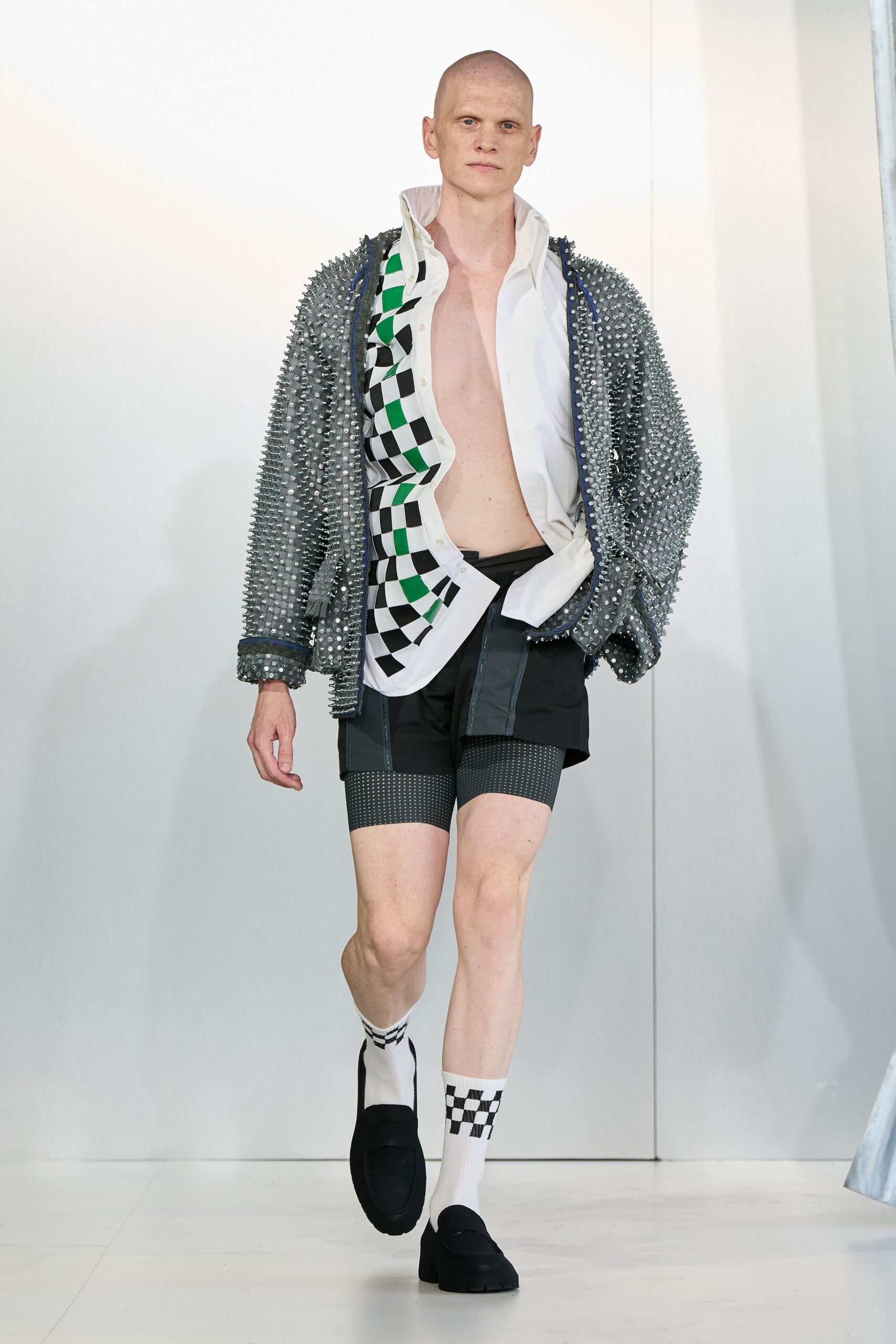 gray spiked jacket with black shorts