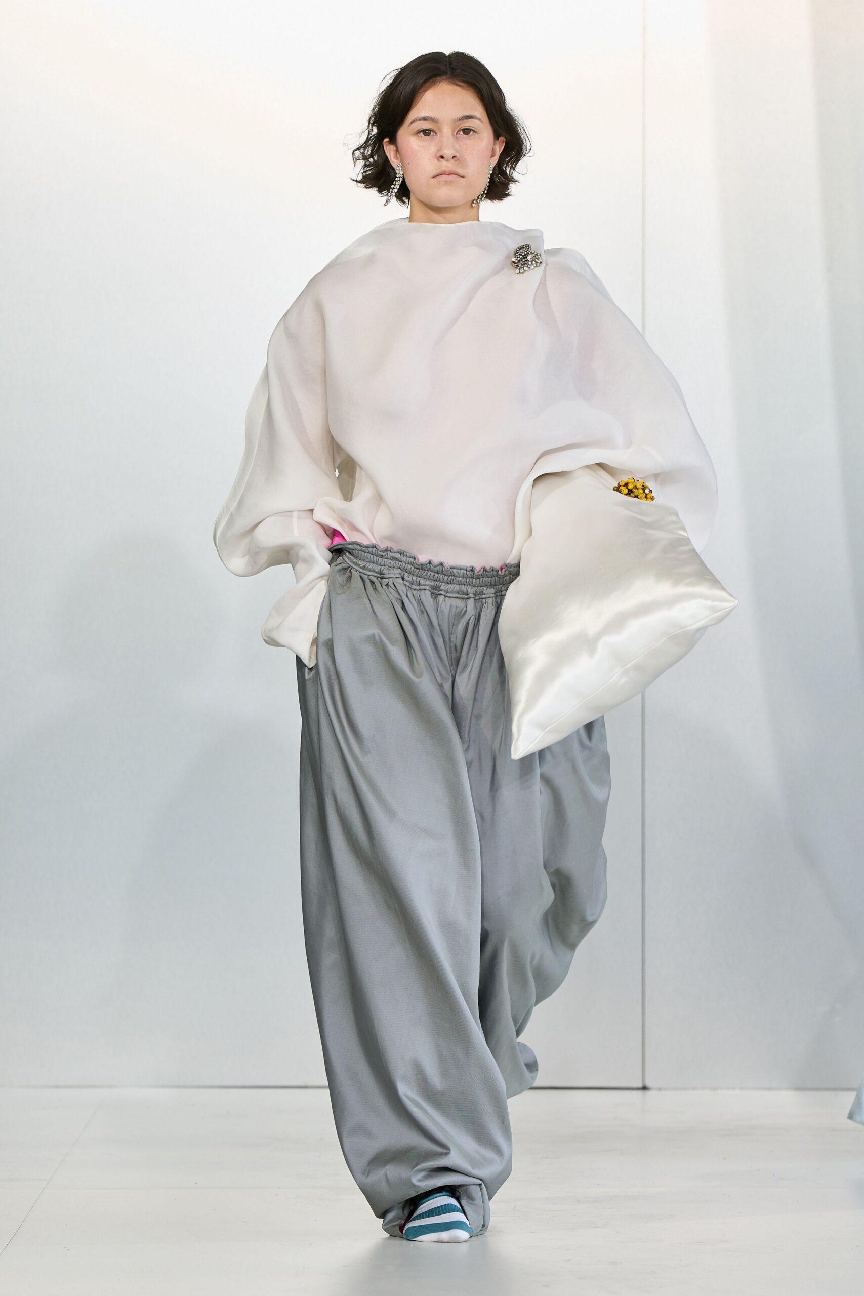 oversized white top gray pants