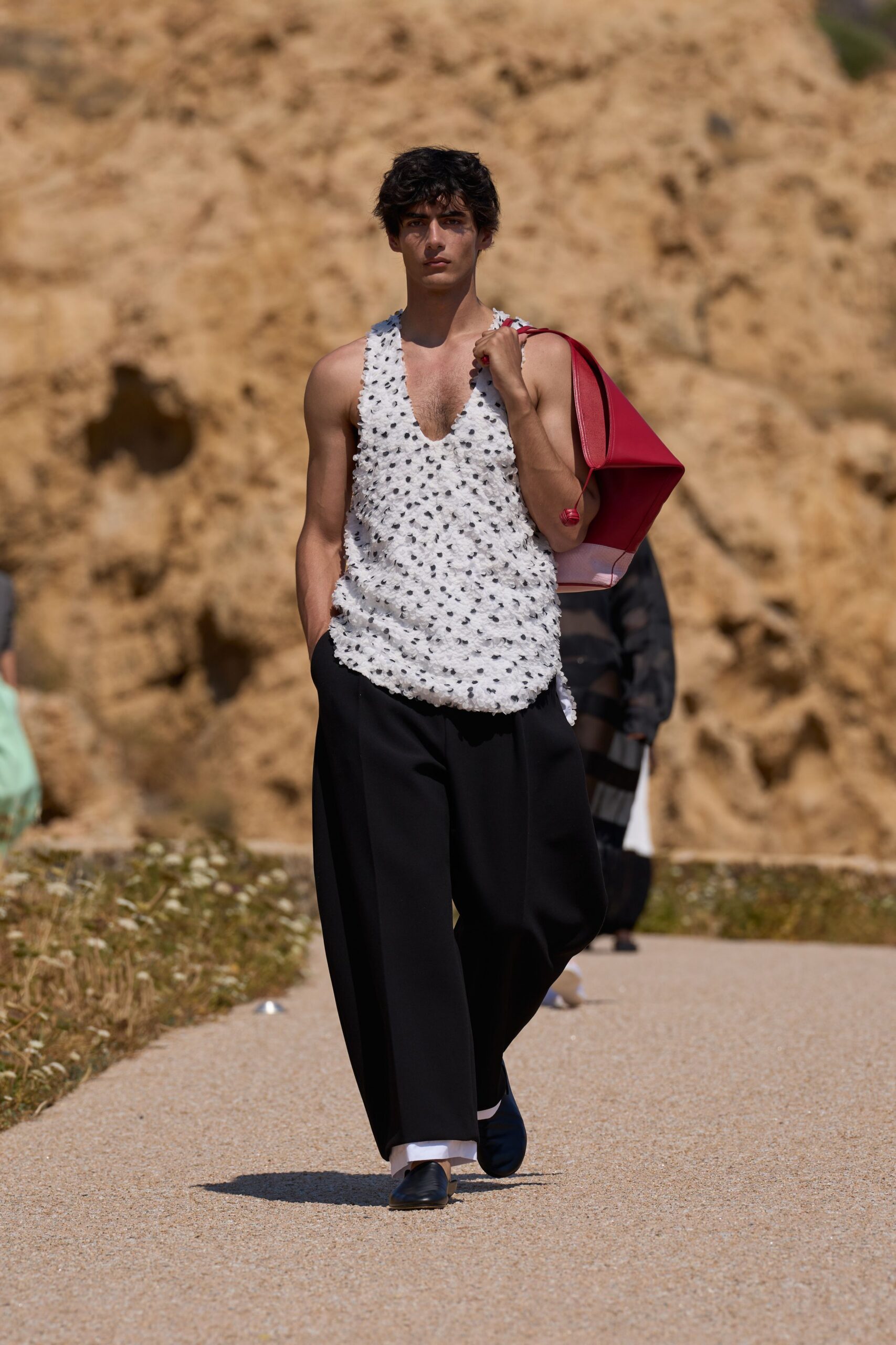 white ruffled top with black pants