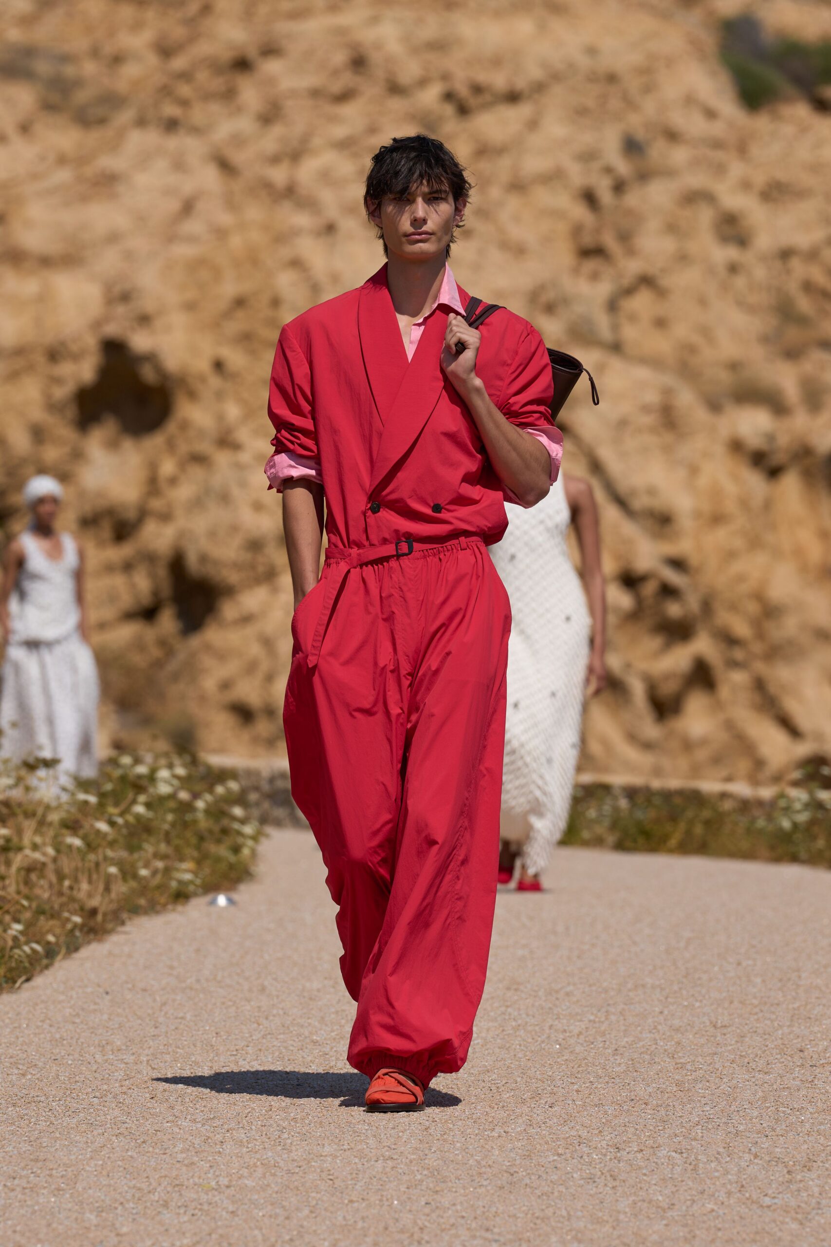 red relaxed jumpsuit with orange shoes