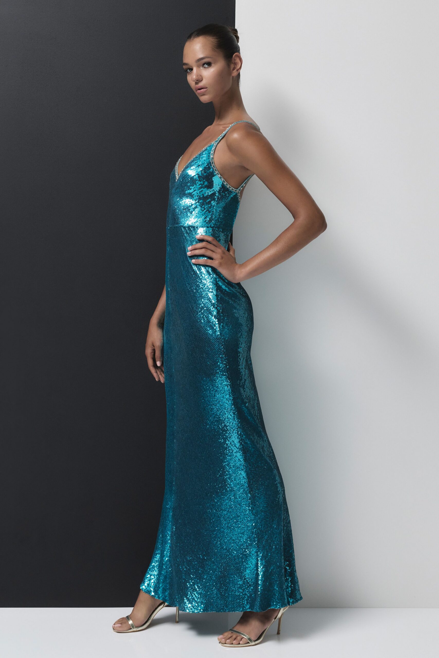 blue sequin sleeveless v-neck fitted flowing shiny gown