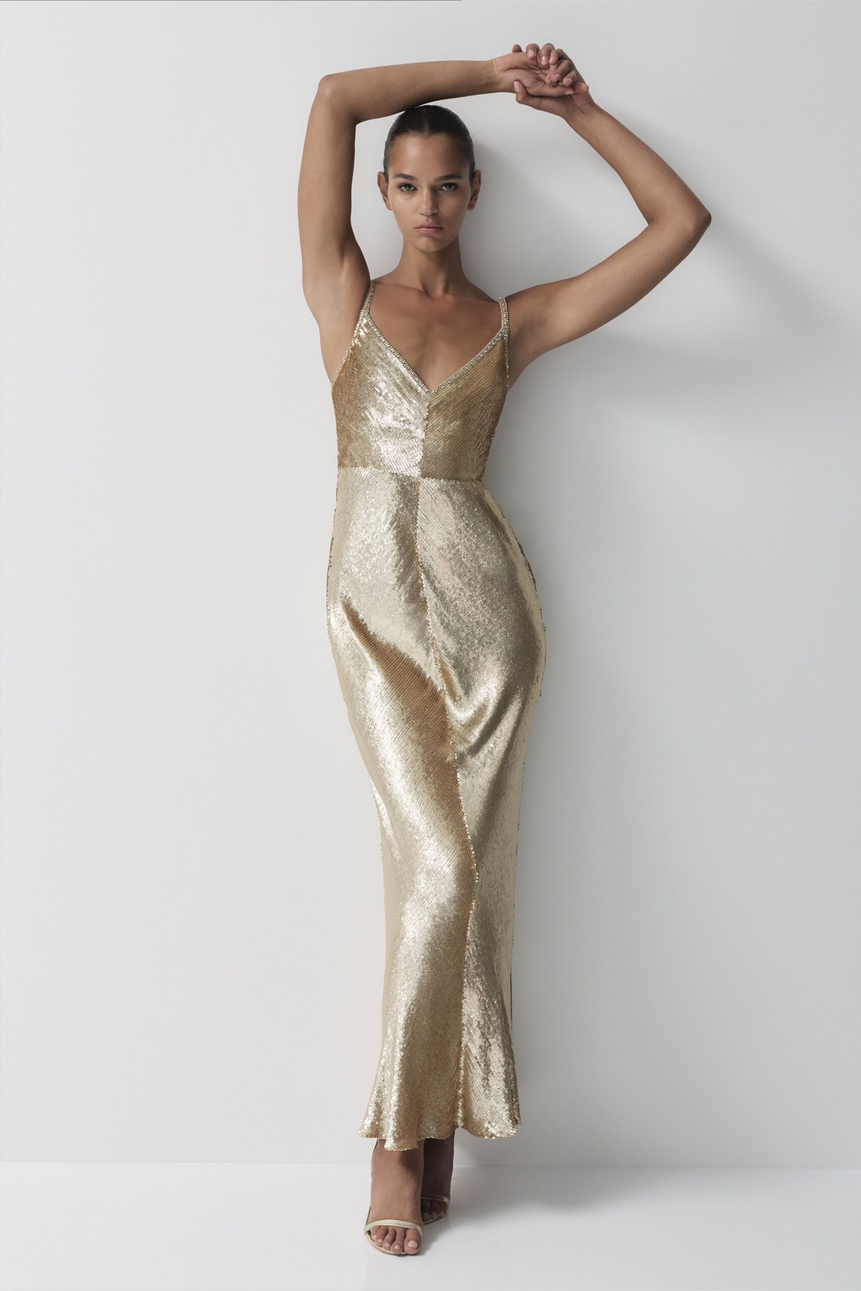 gold silk sleeveless v-neck fitted sequined shiny gown