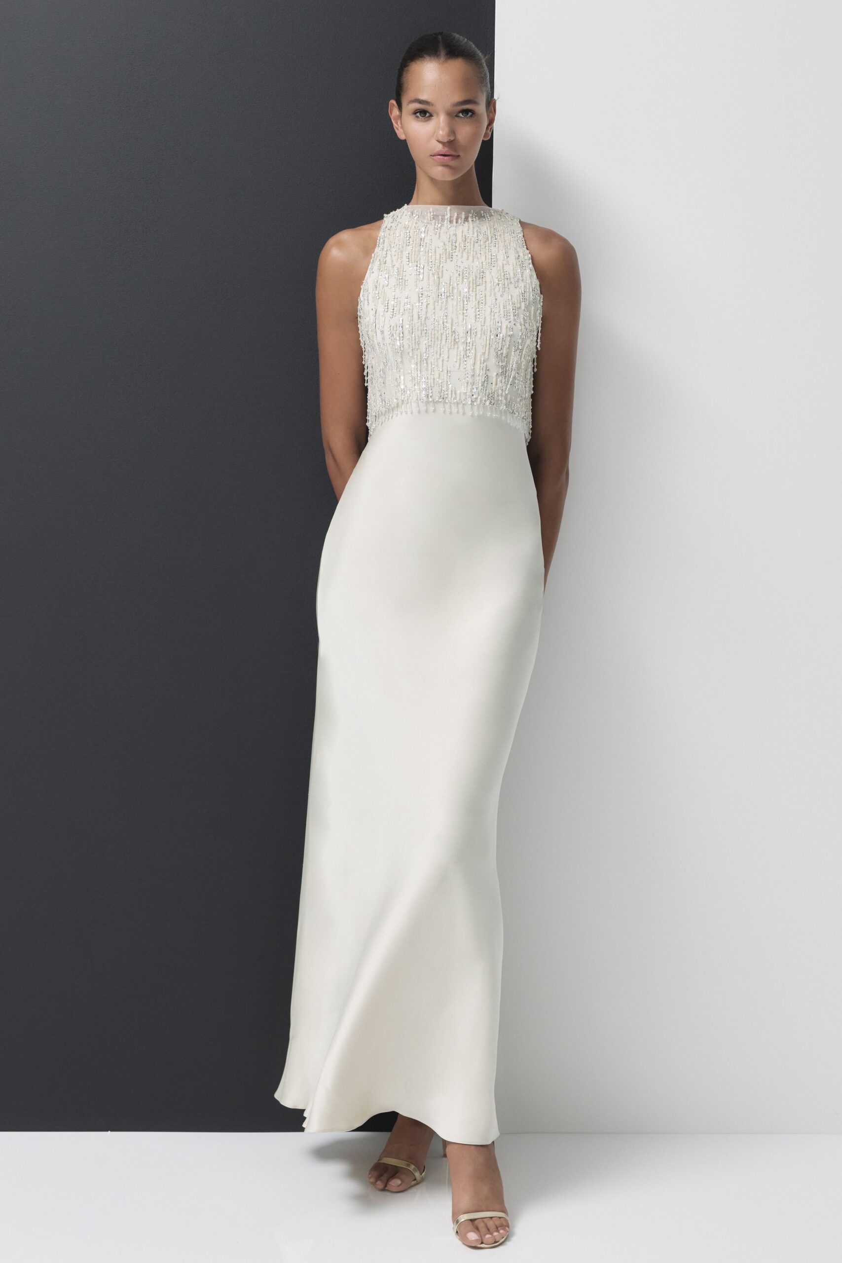 white silk sleeveless high-neck fitted beaded shiny gown