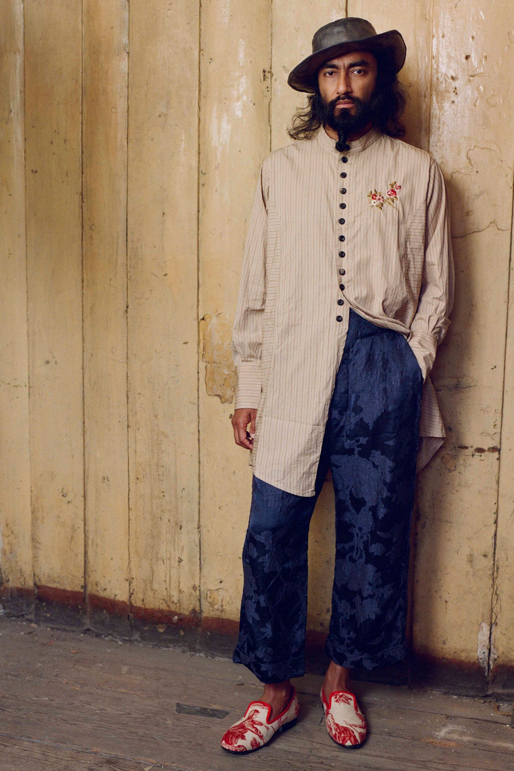 beige striped shirt with blue pants