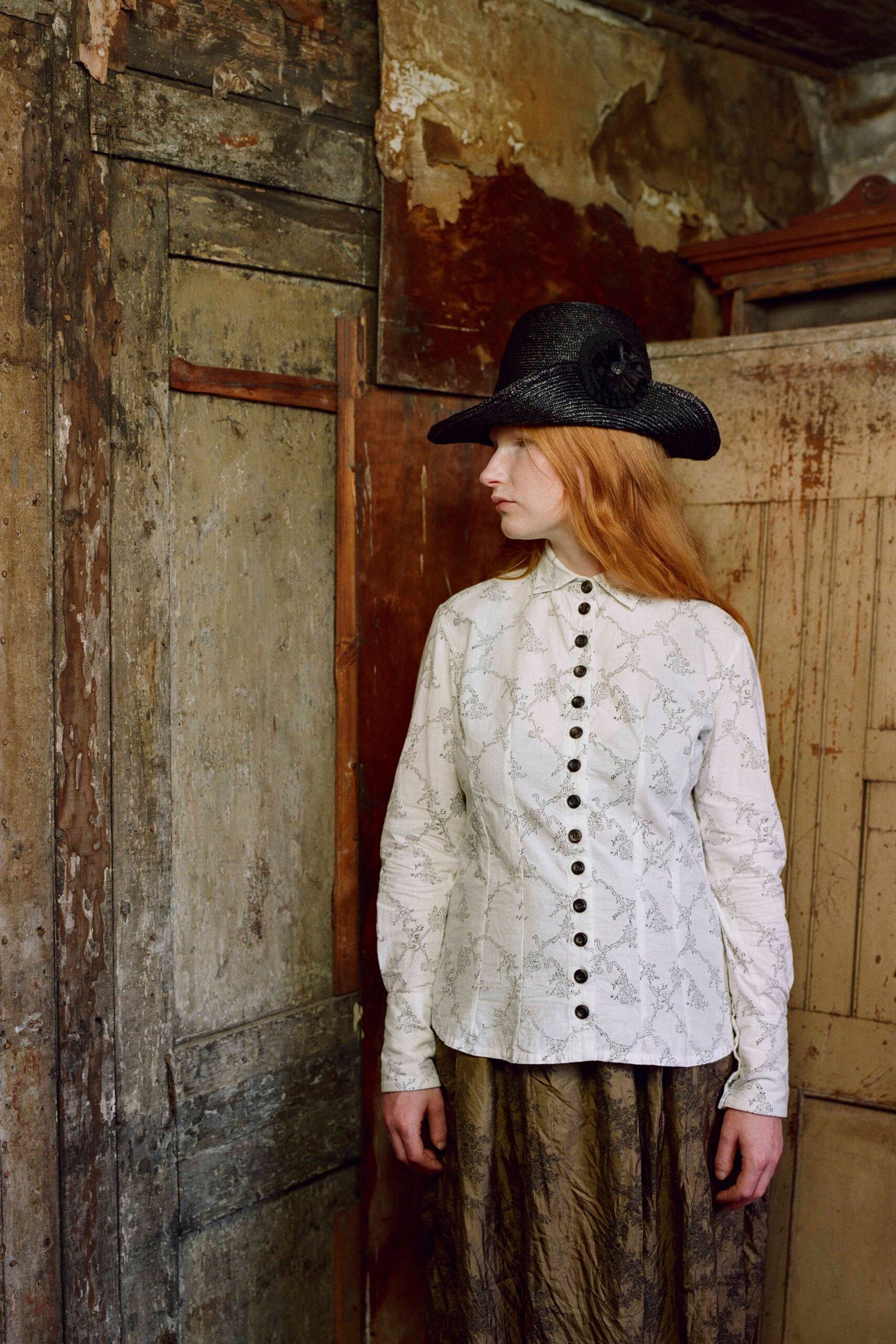 white embroidered shirt with brown skirt