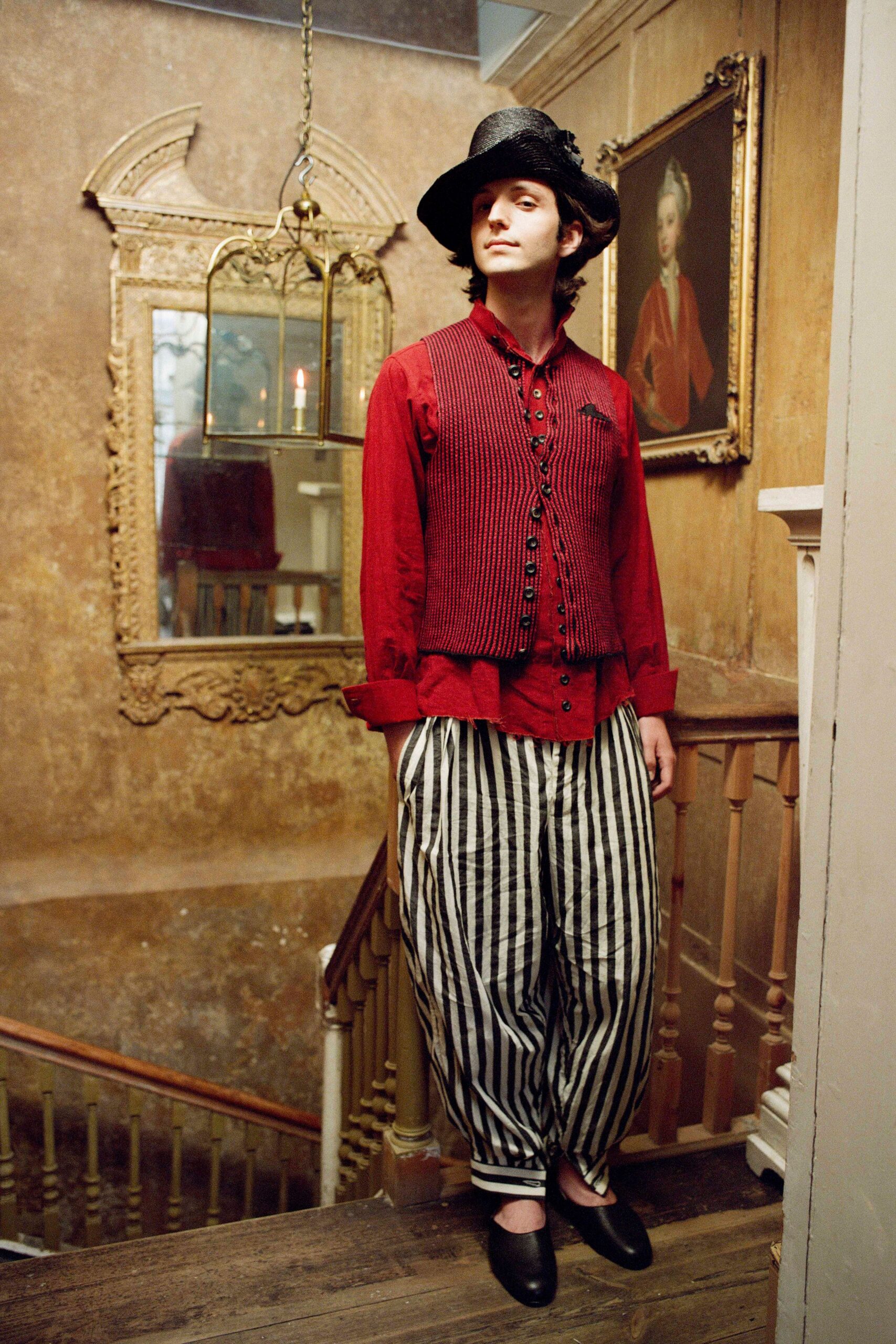 red cotton vest with striped pants