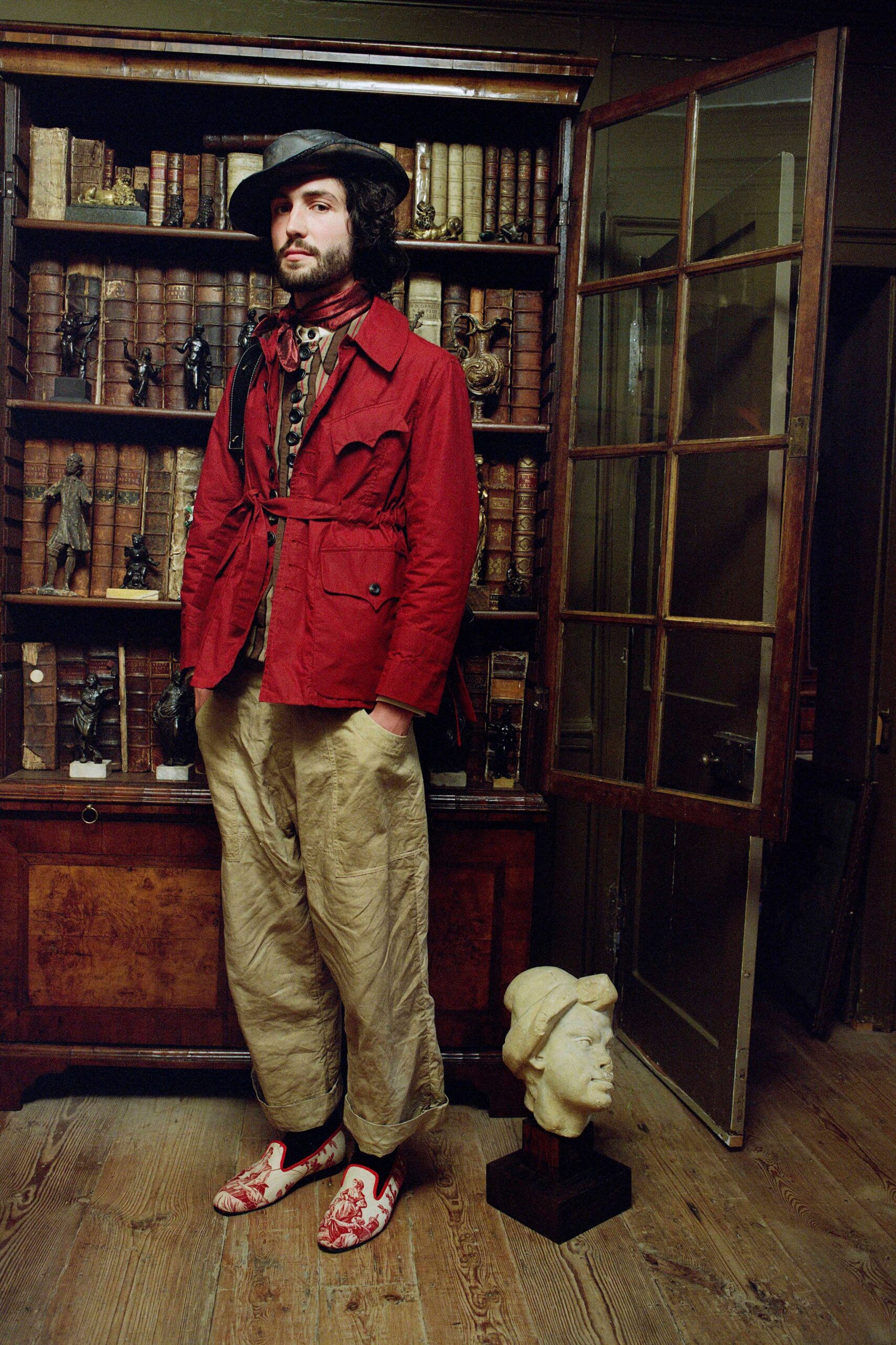 red cotton jacket with beige pants