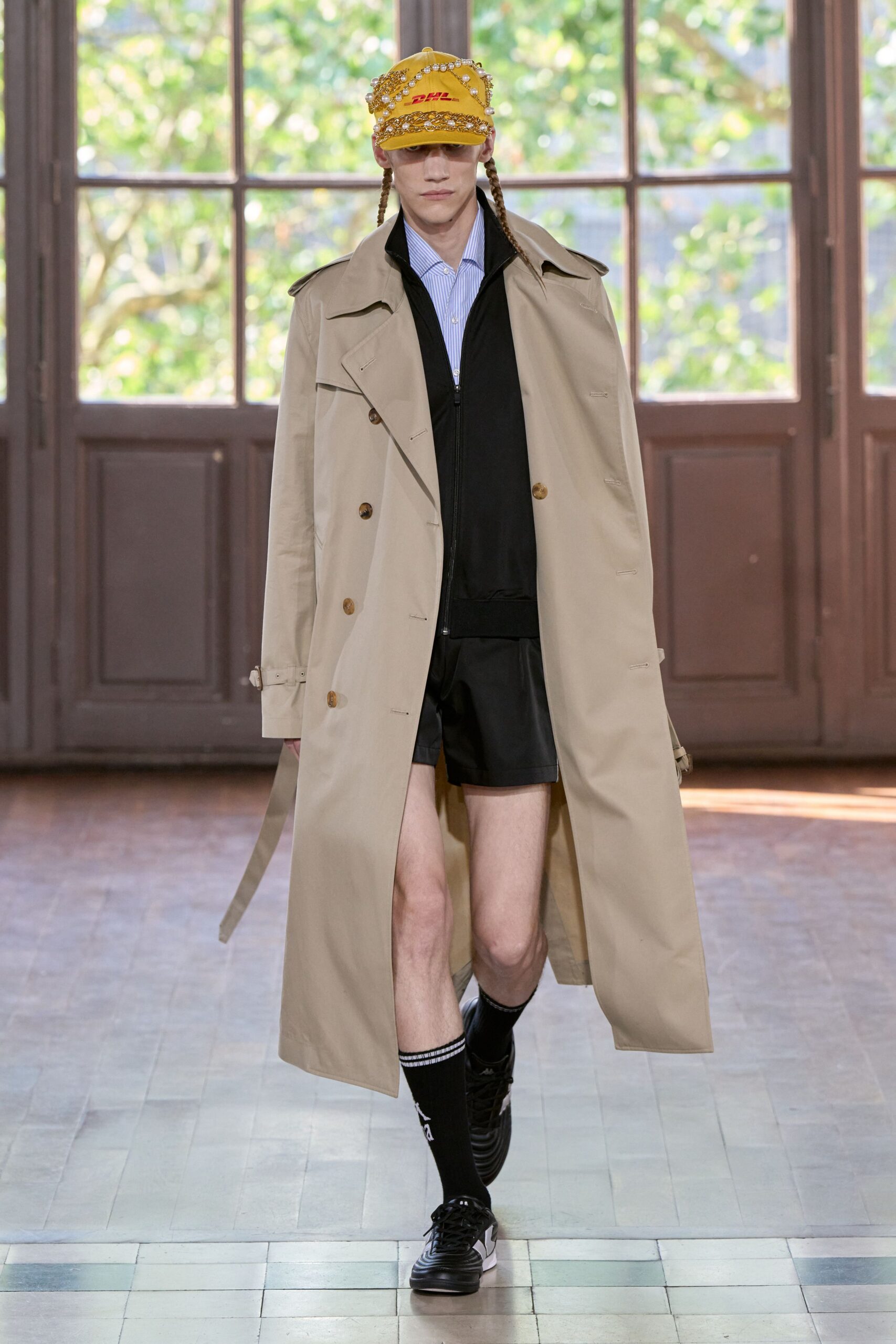 beige trench coat with black sweater