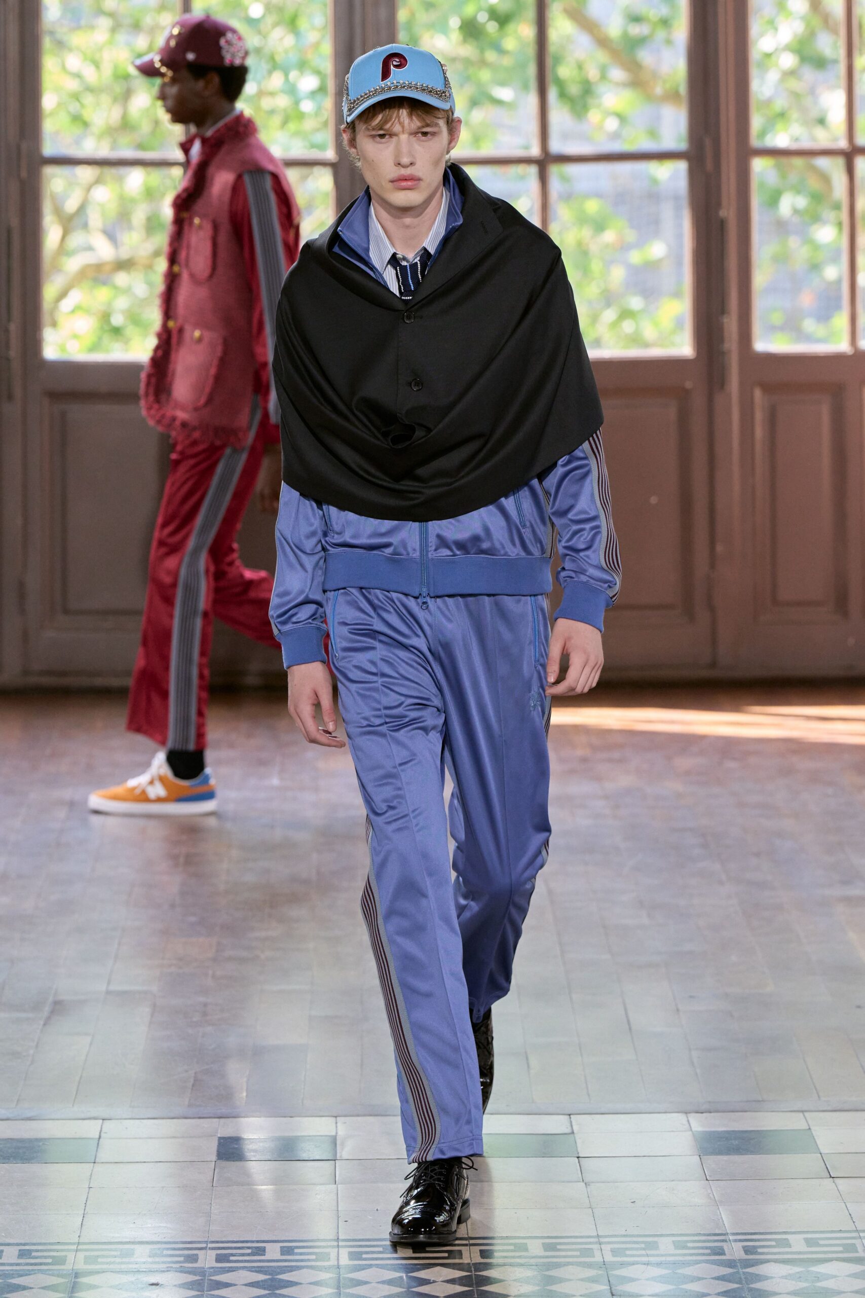 black jacket blue shirt pants