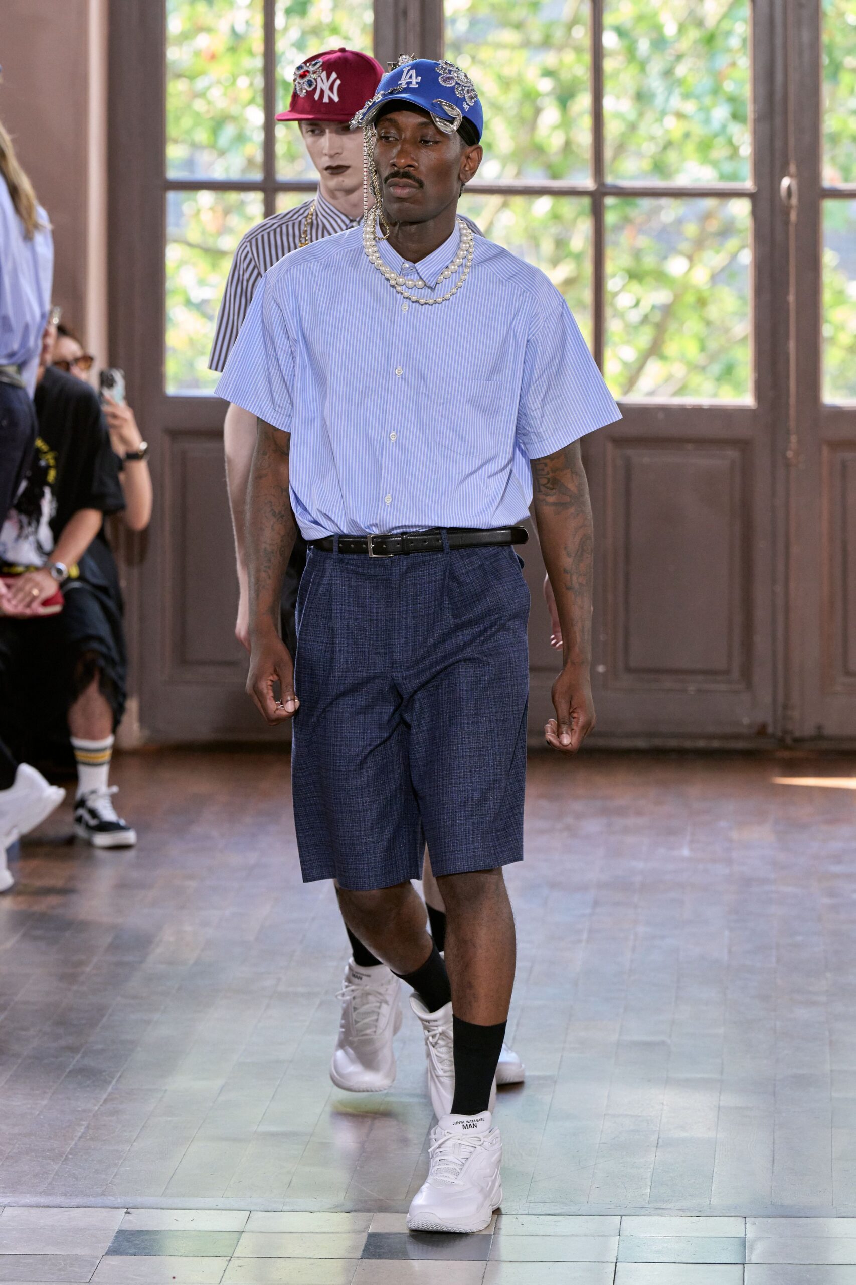 blue striped shirt and navy shorts