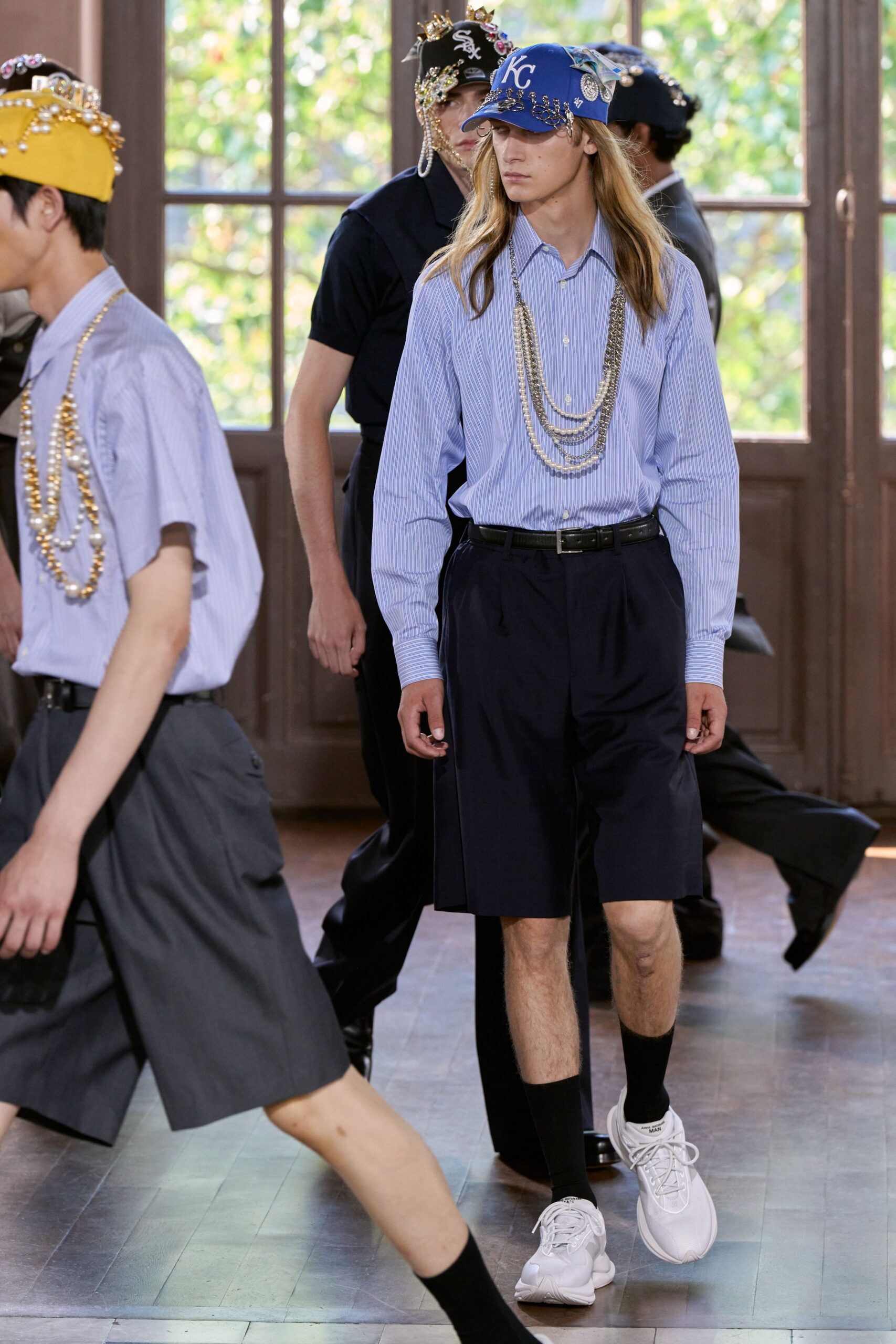 blue striped shirt with black shorts
