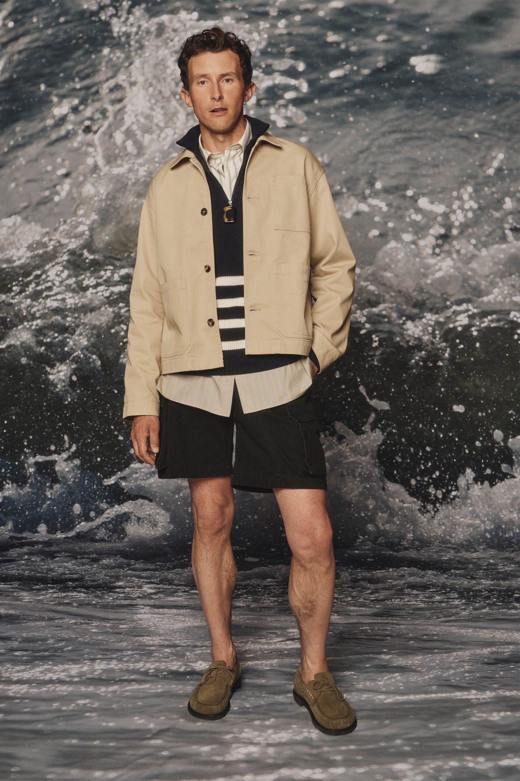 beige jacket with black sweater