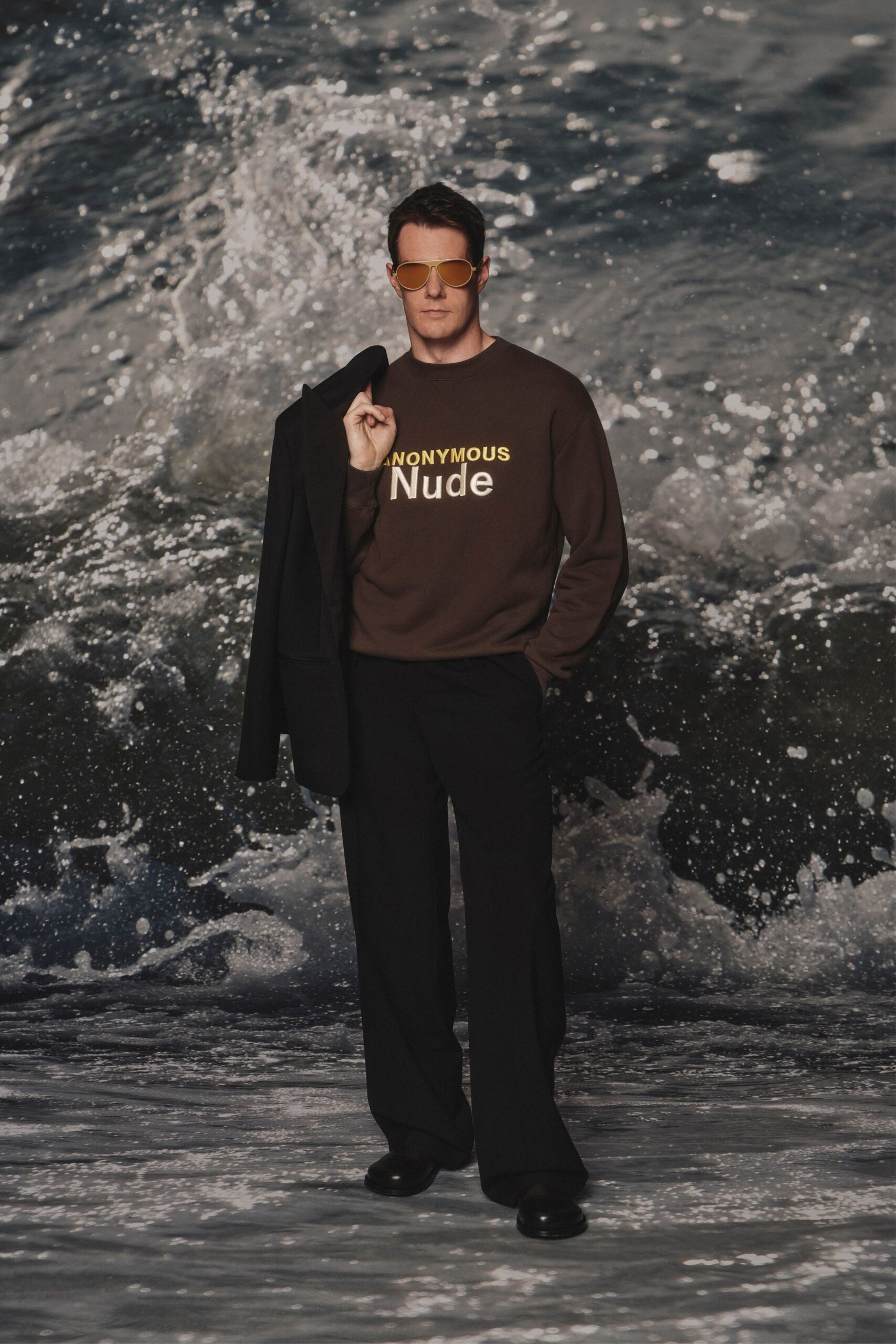 brown relaxed sweater with printed text