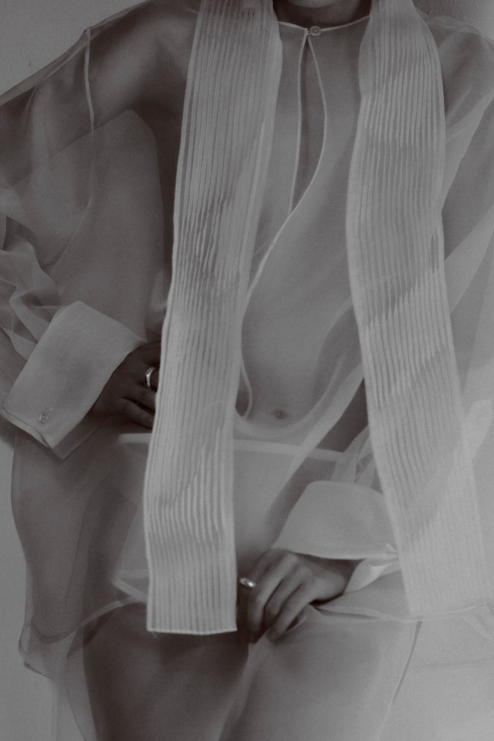 white silk long-sleeve collared relaxed pleated sheer shirt