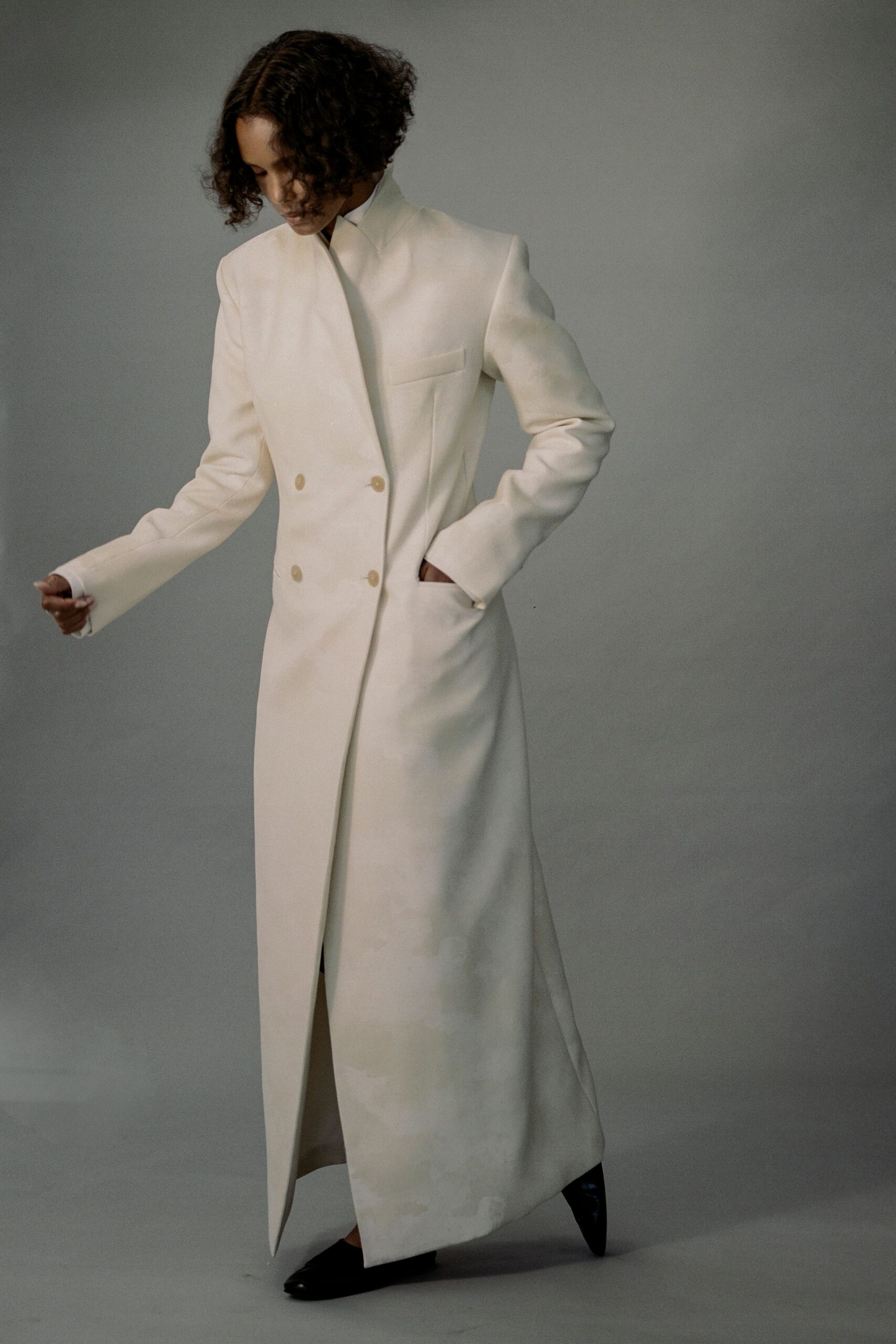 white wool long-sleeve collared structured buttoned maxi coat