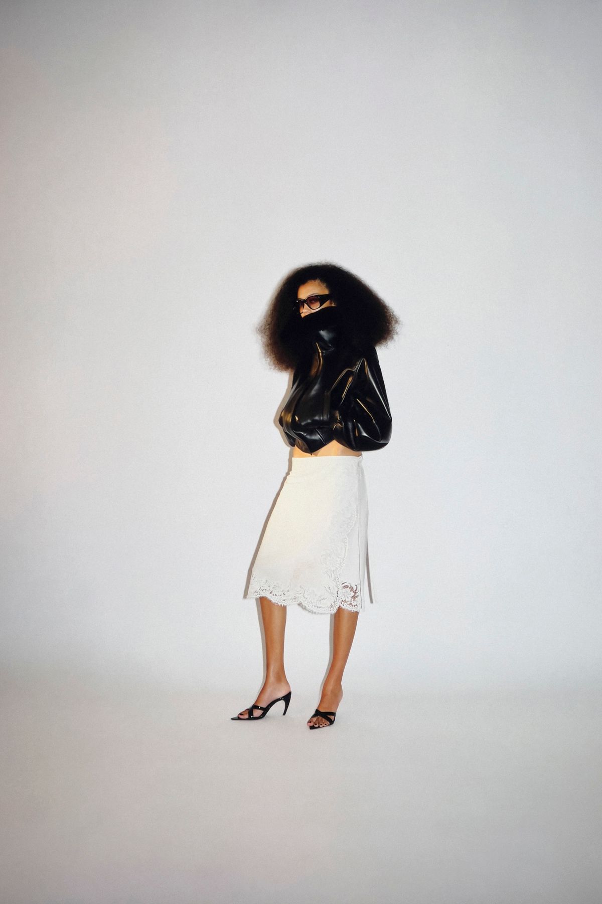 black leather fitted top with white skirt