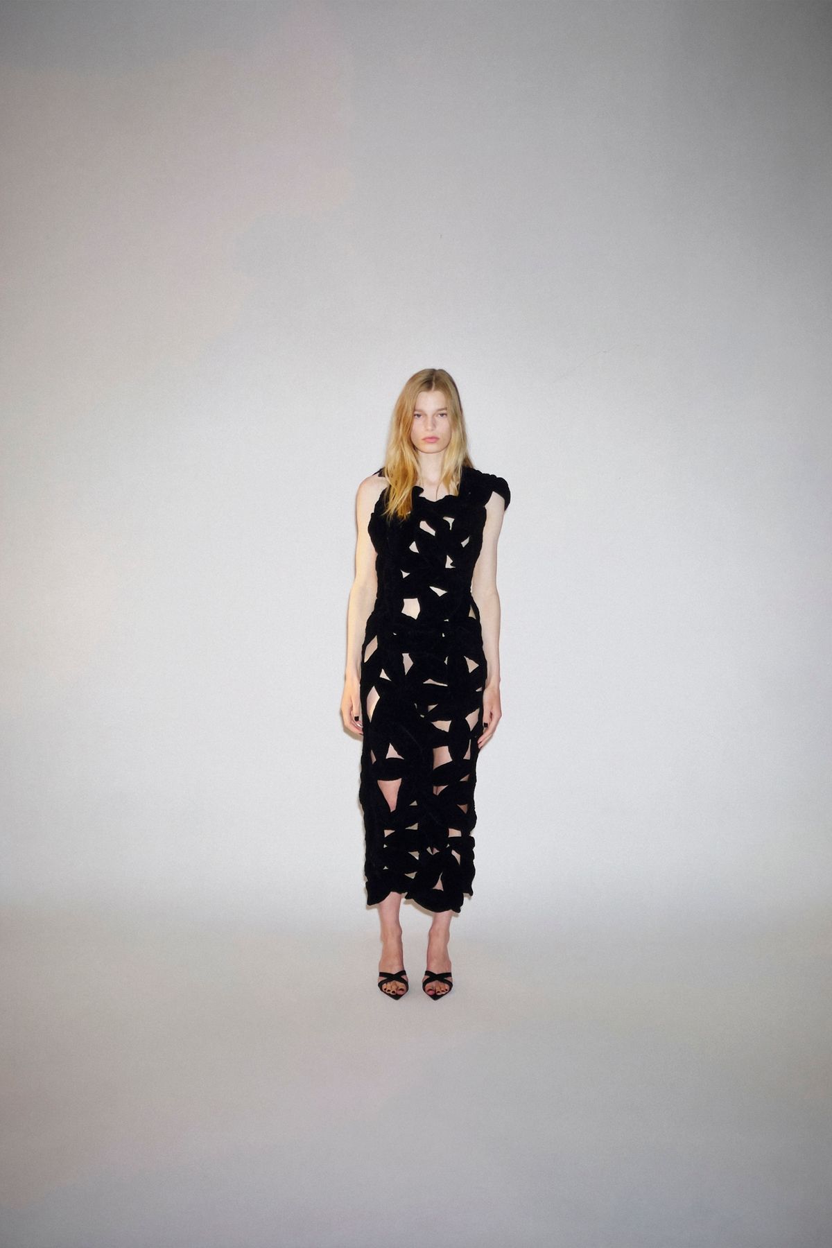 black cutout midi dress with strappy shoes
