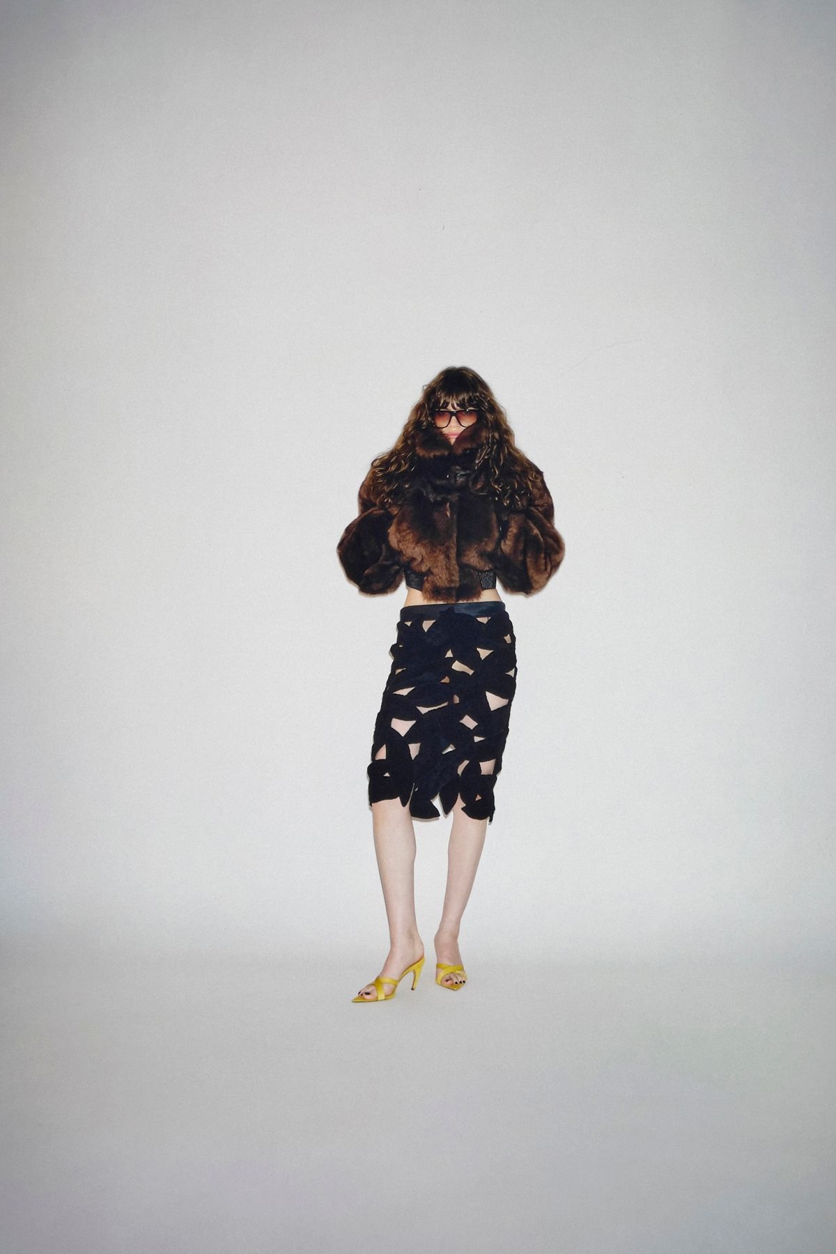 brown fur jacket with black skirt