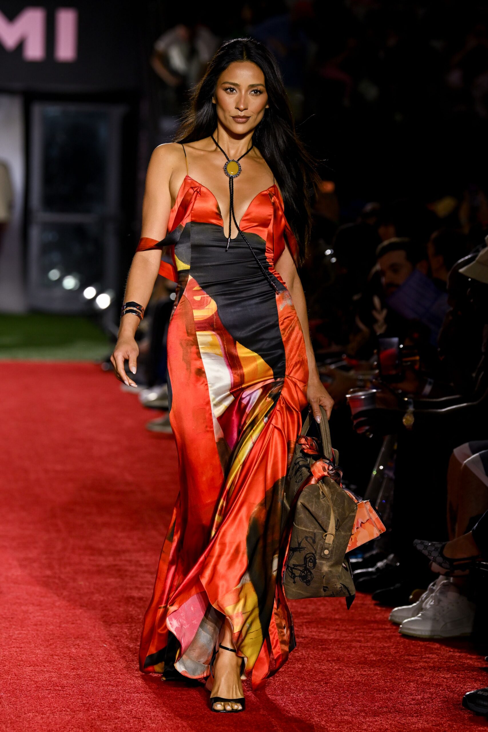 red silk sleeveless v-neck fitted draped flowing gown