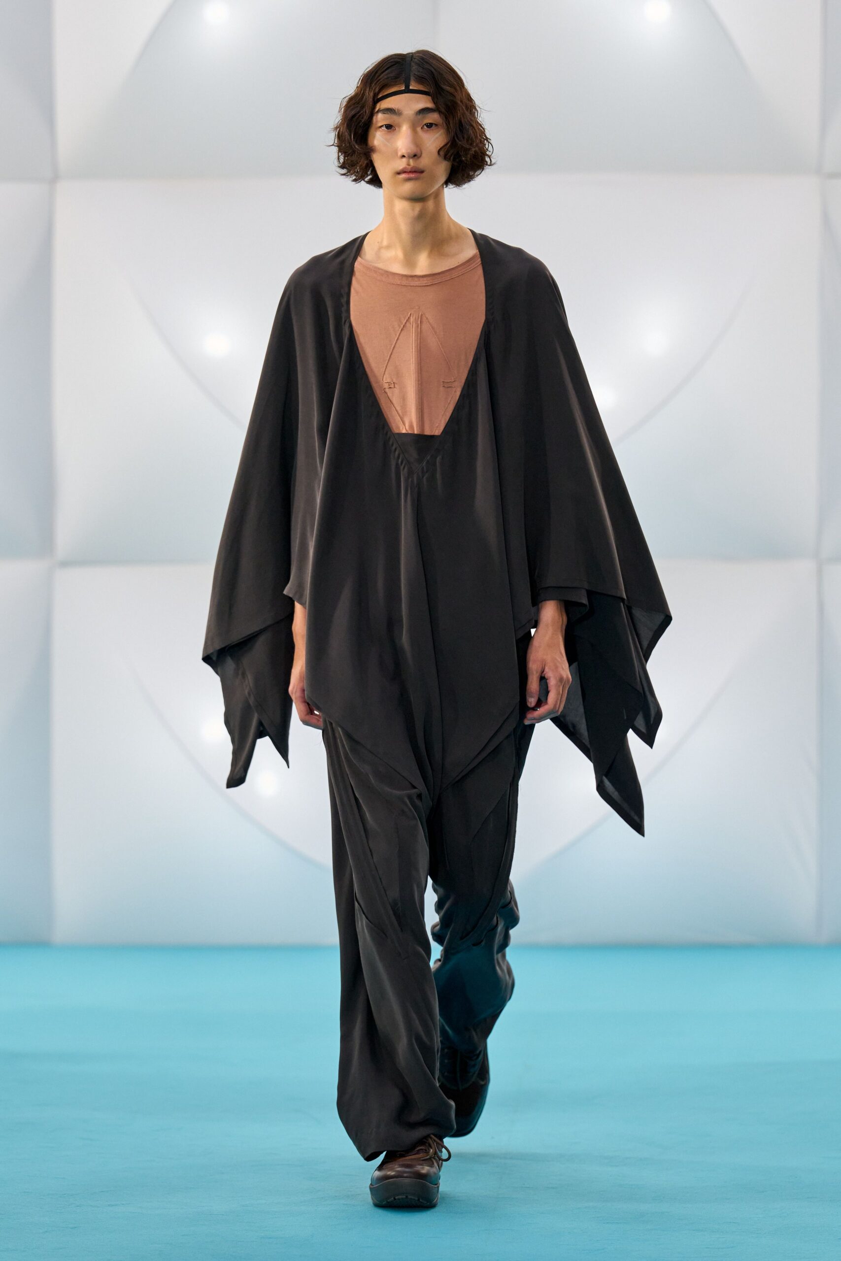 black poncho with beige top