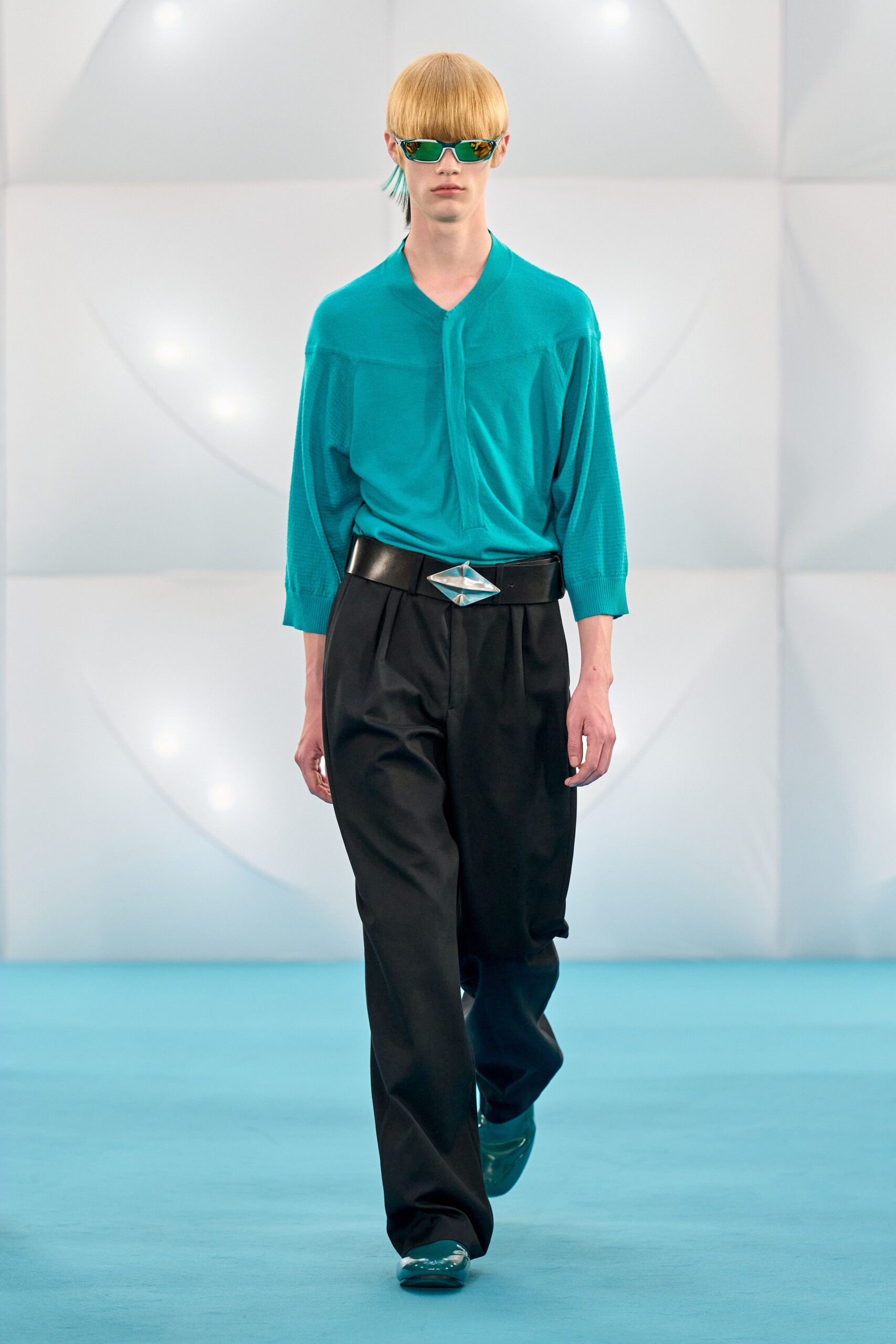 teal shirt black pants outfit