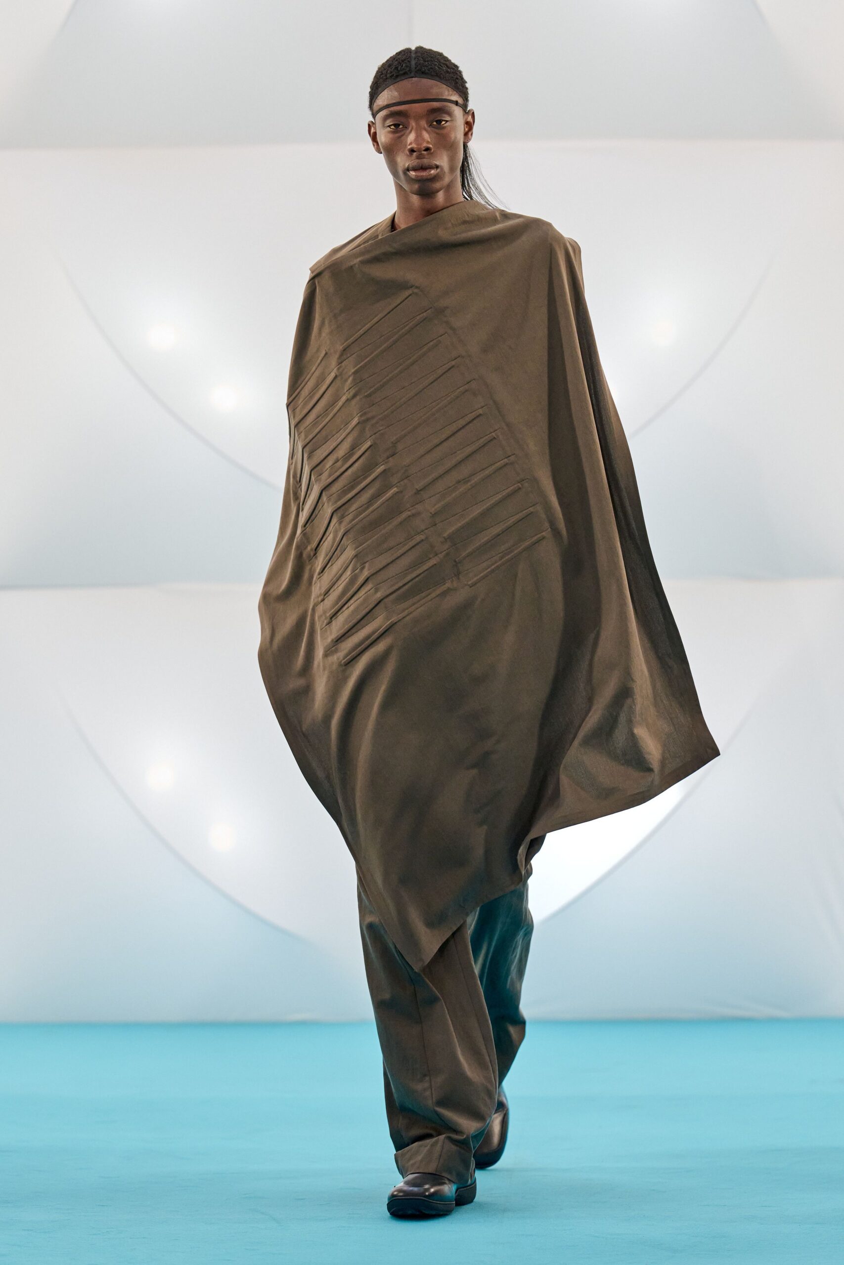 brown oversized poncho with black pants