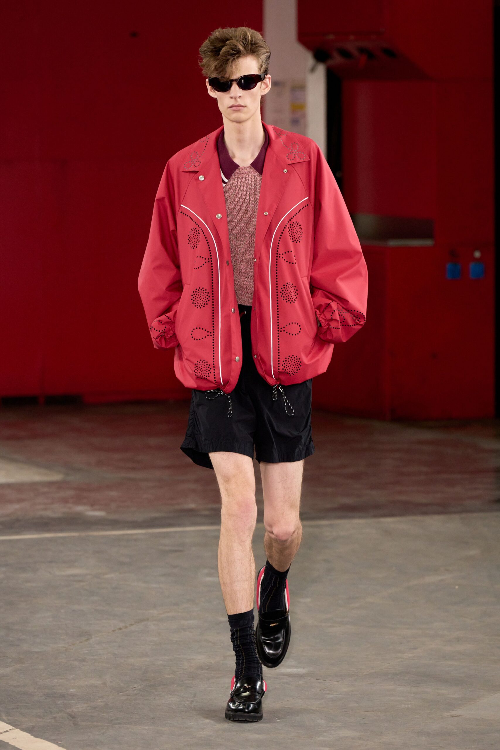 red oversized jacket with black shorts