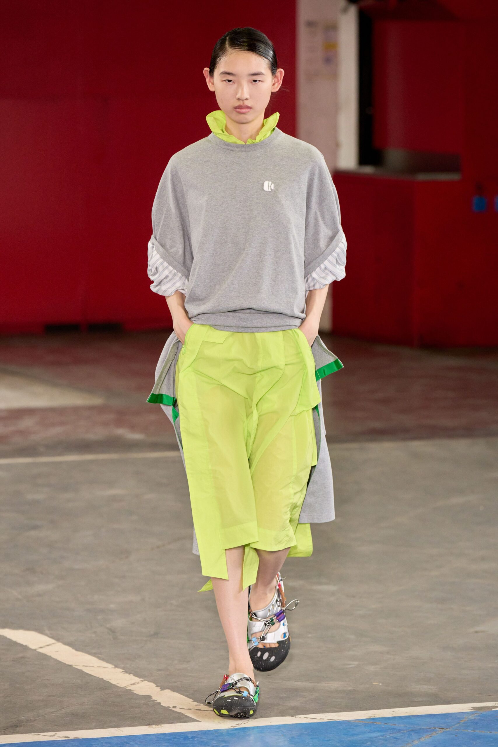 gray relaxed top with layered green pants