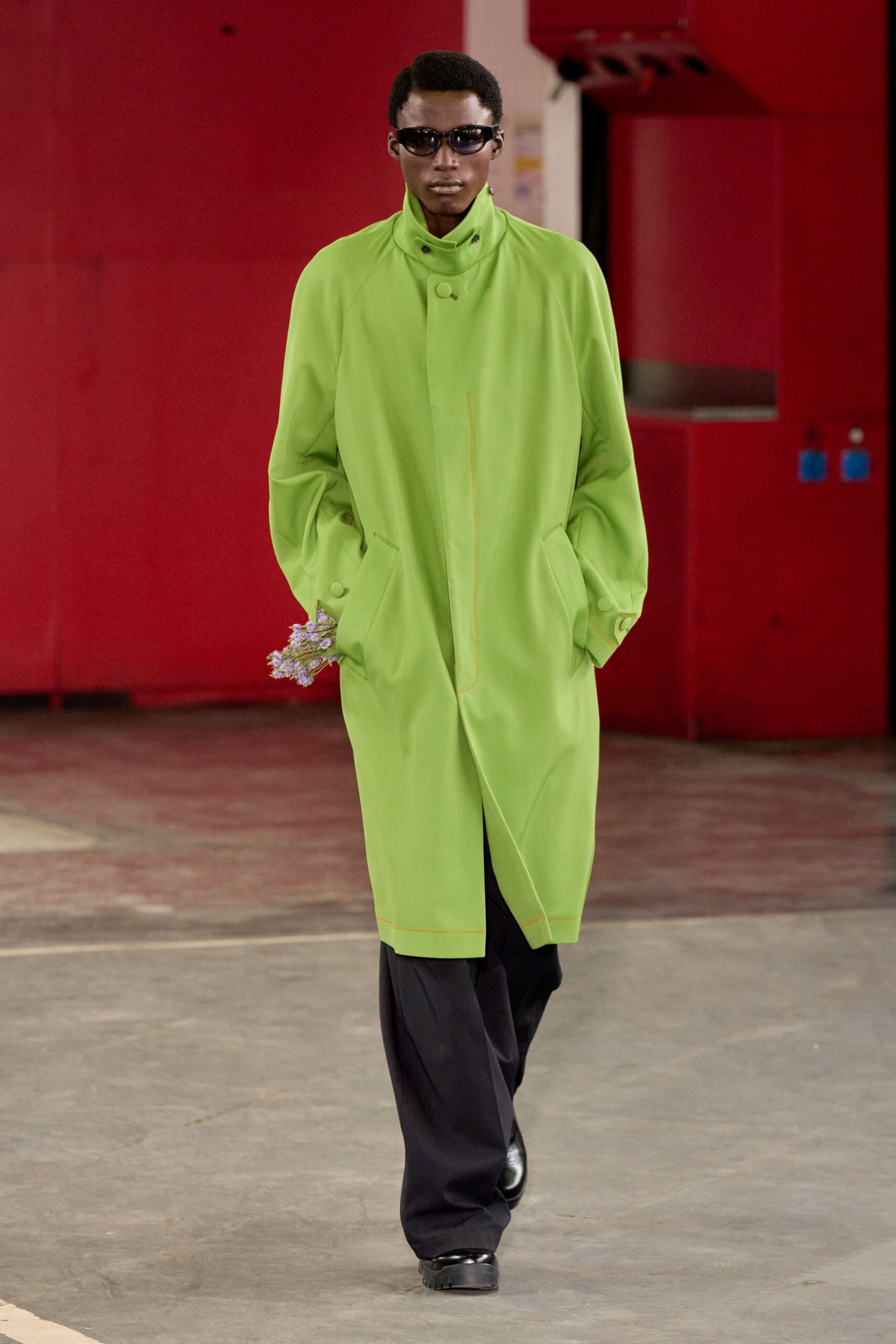 green oversized coat with black pants
