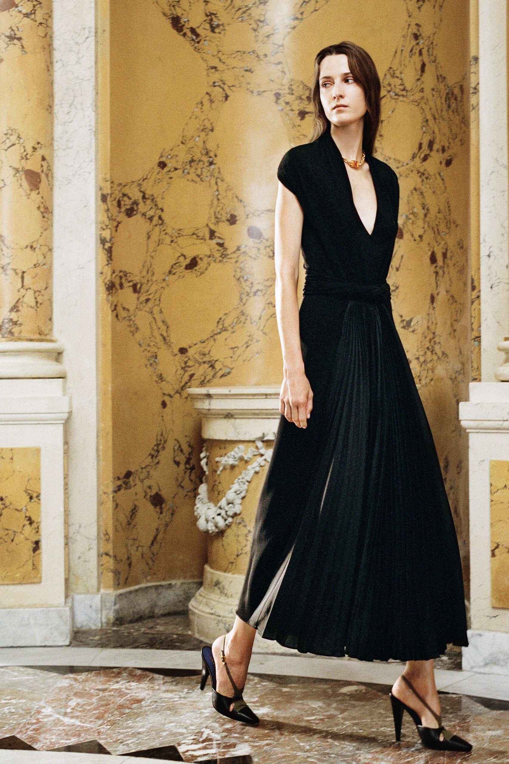black silk short-sleeve v-neck fitted pleated flowing gown