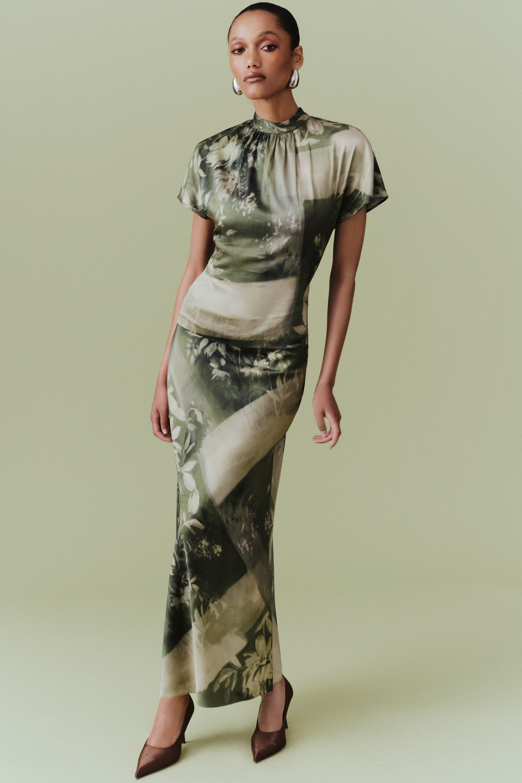 green silk short-sleeve high-neck fitted floral draped dress