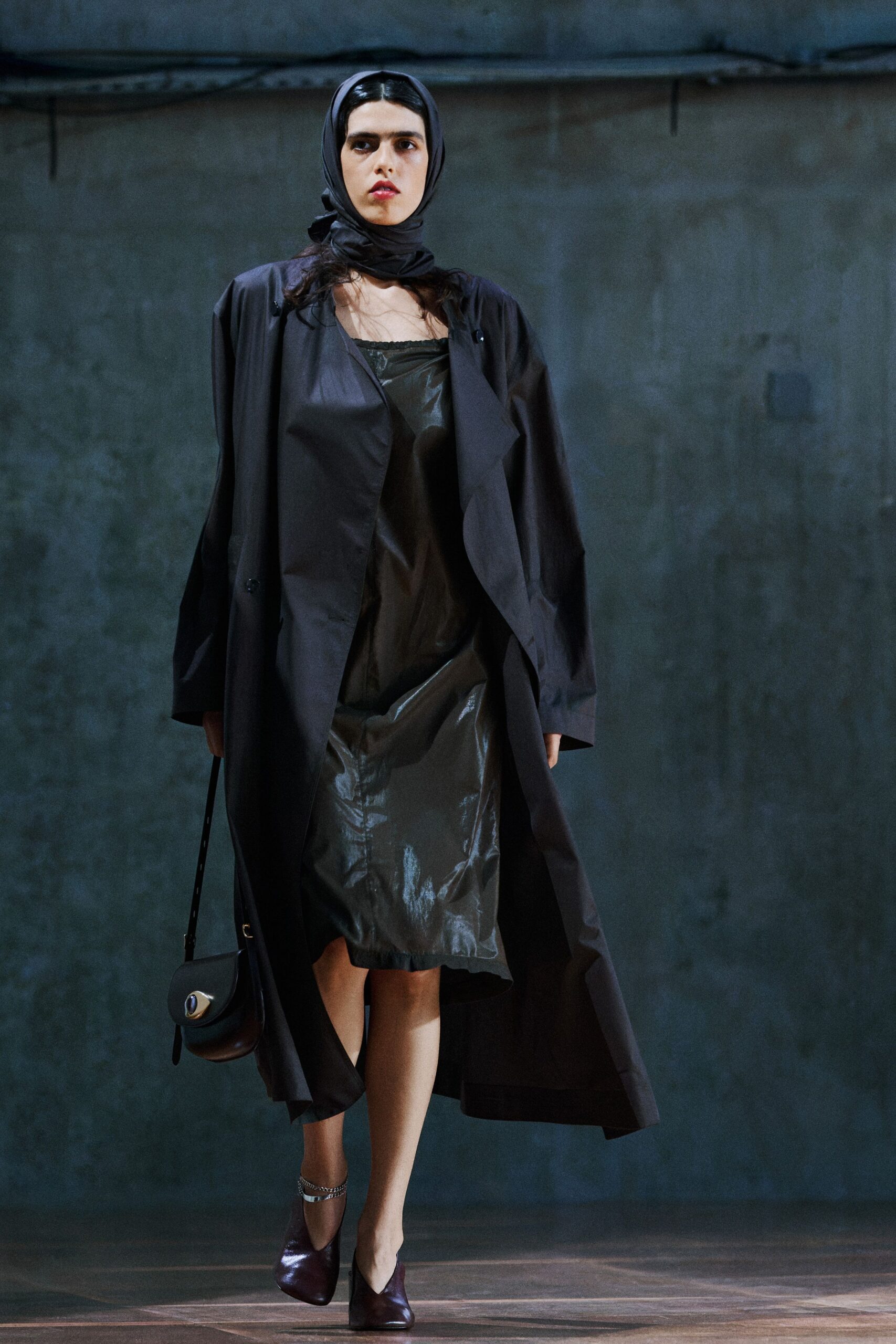 black vinyl long-sleeve collared relaxed buttoned coat