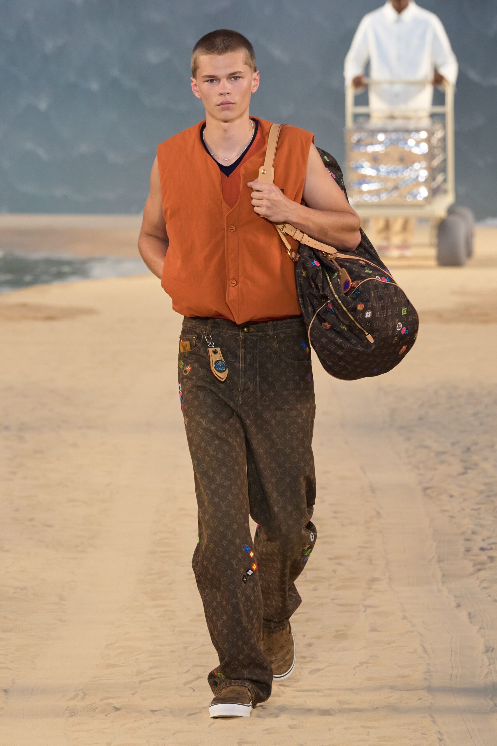 orange vest red shirt brown pants