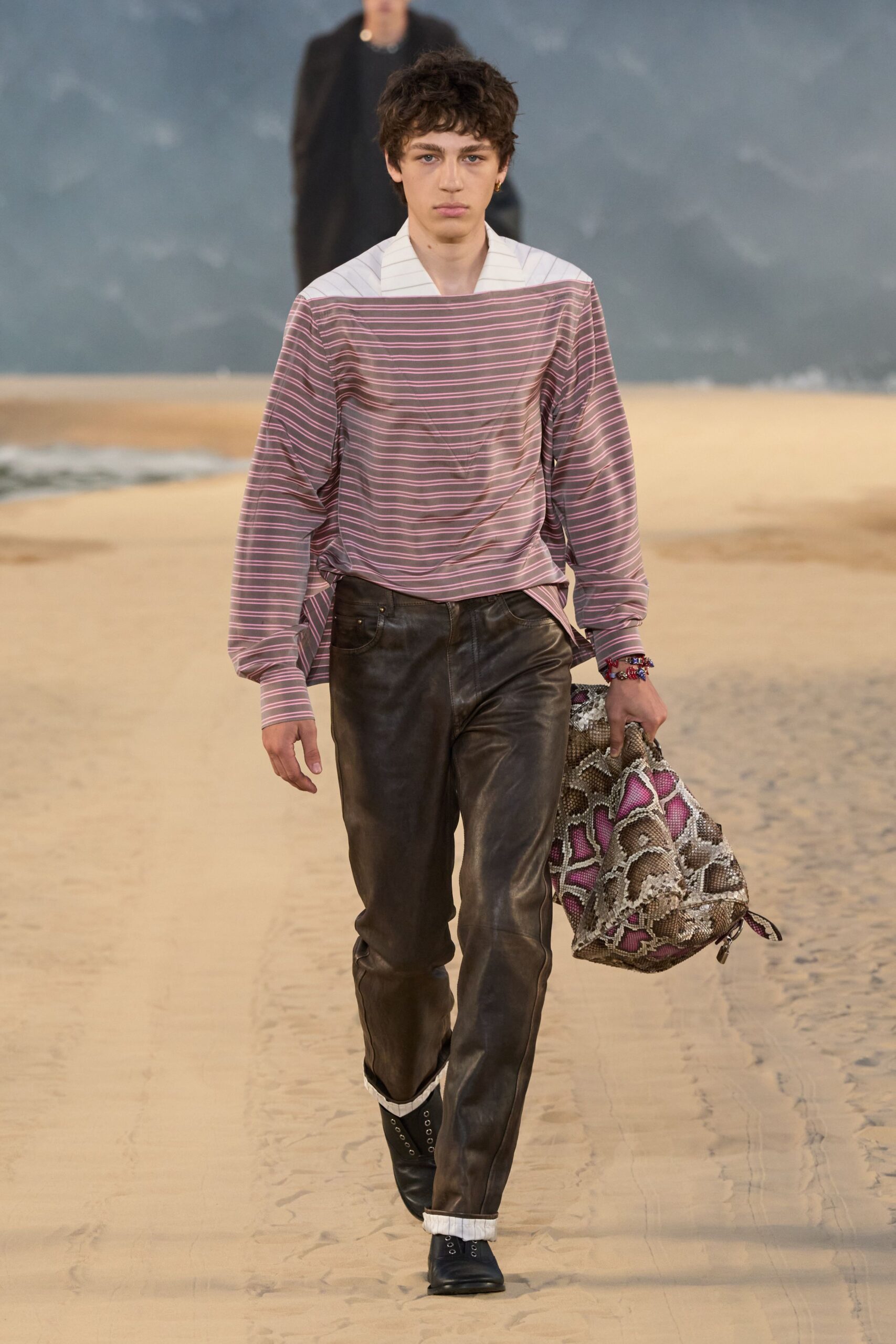 pink striped shirt with leather pants