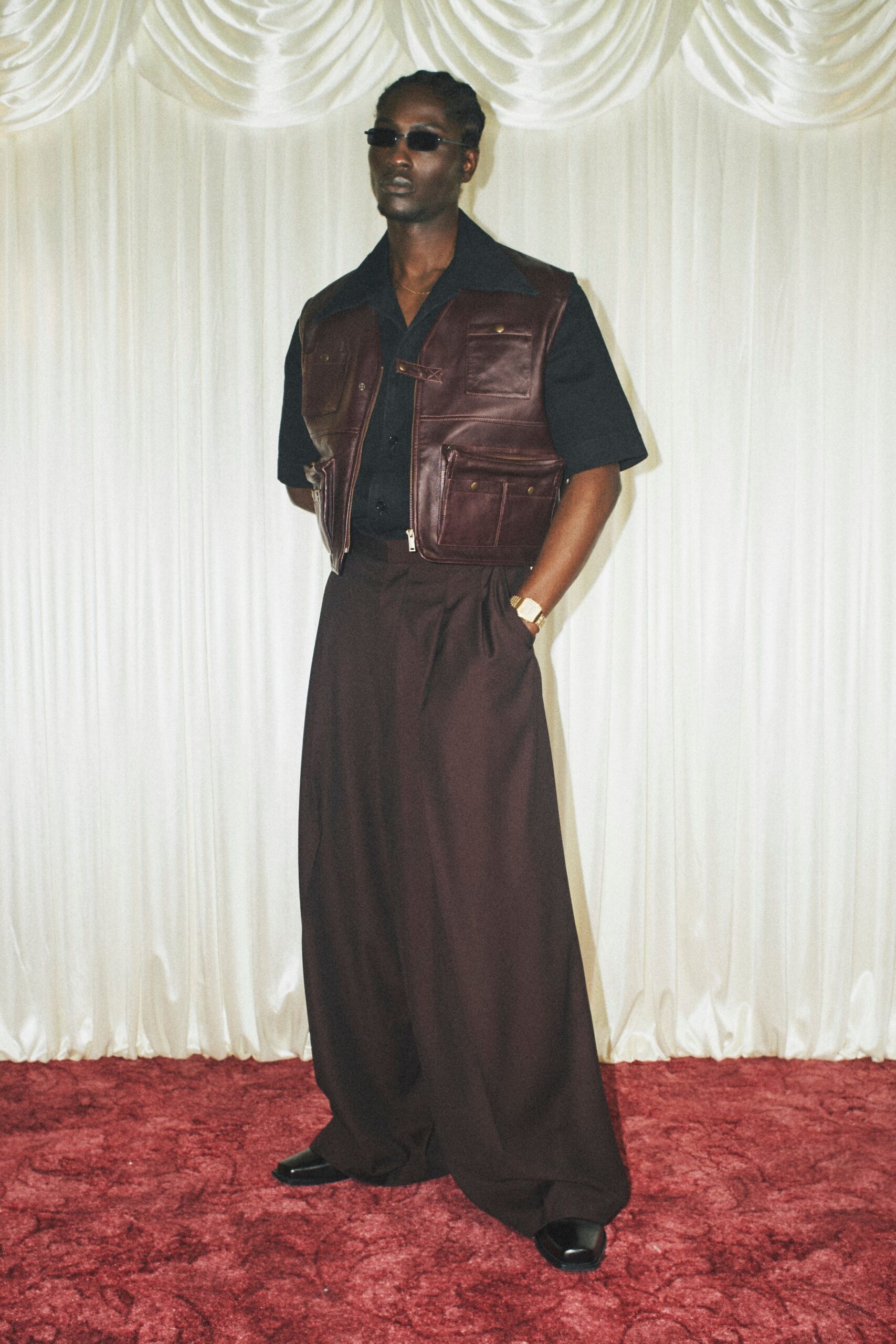 brown leather vest black shirt