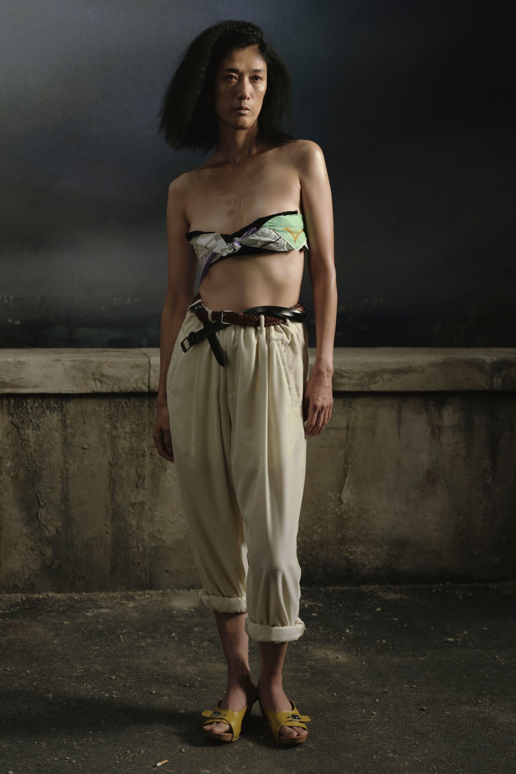 multi-colored sleeveless top and beige pants