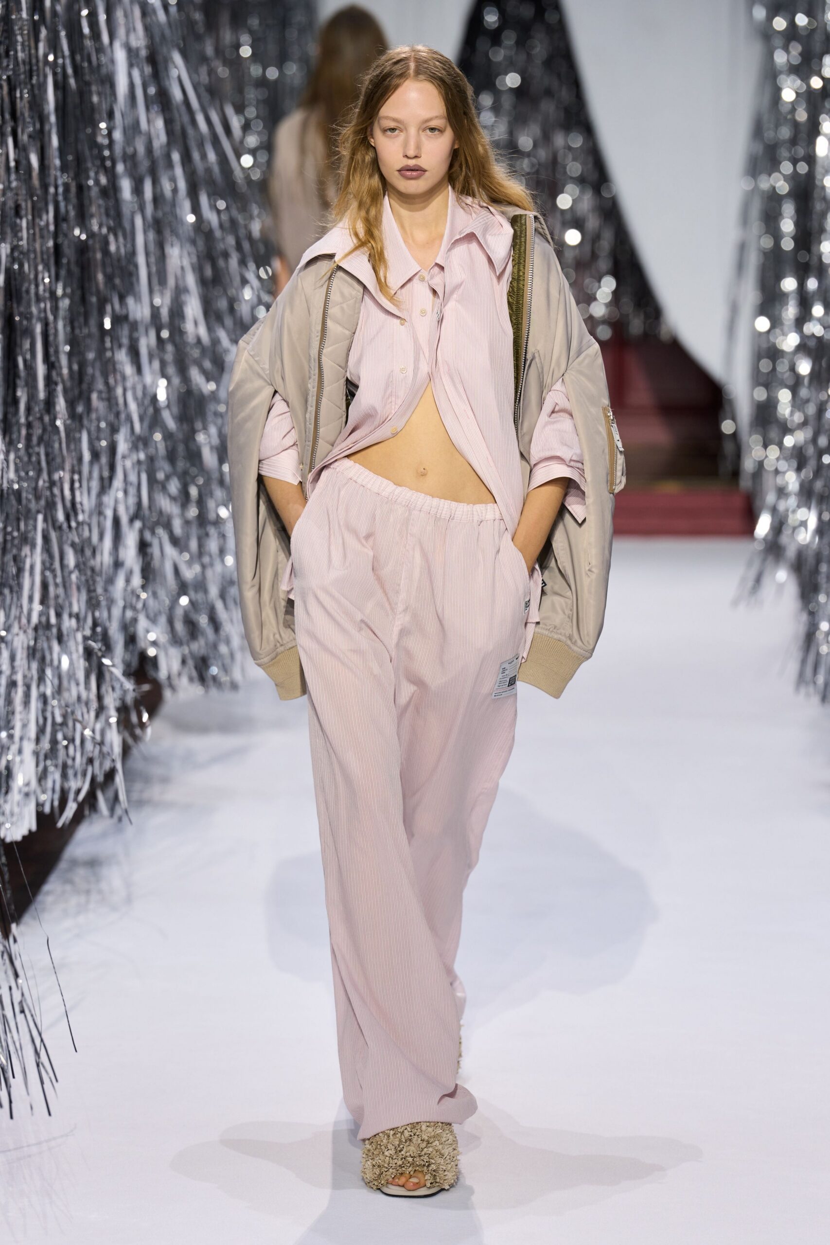 beige jacket pink shirt pants