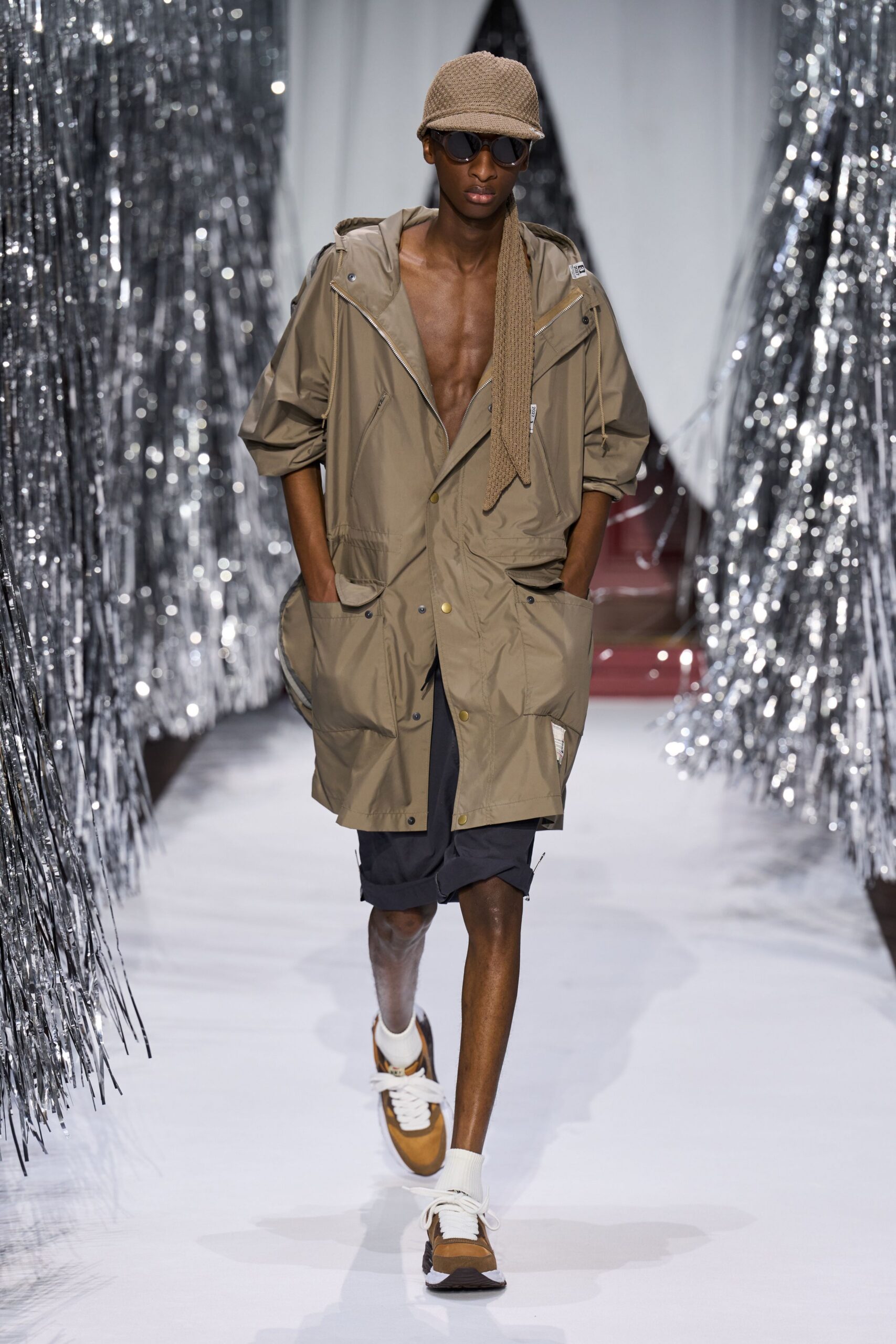 beige parka with black shorts
