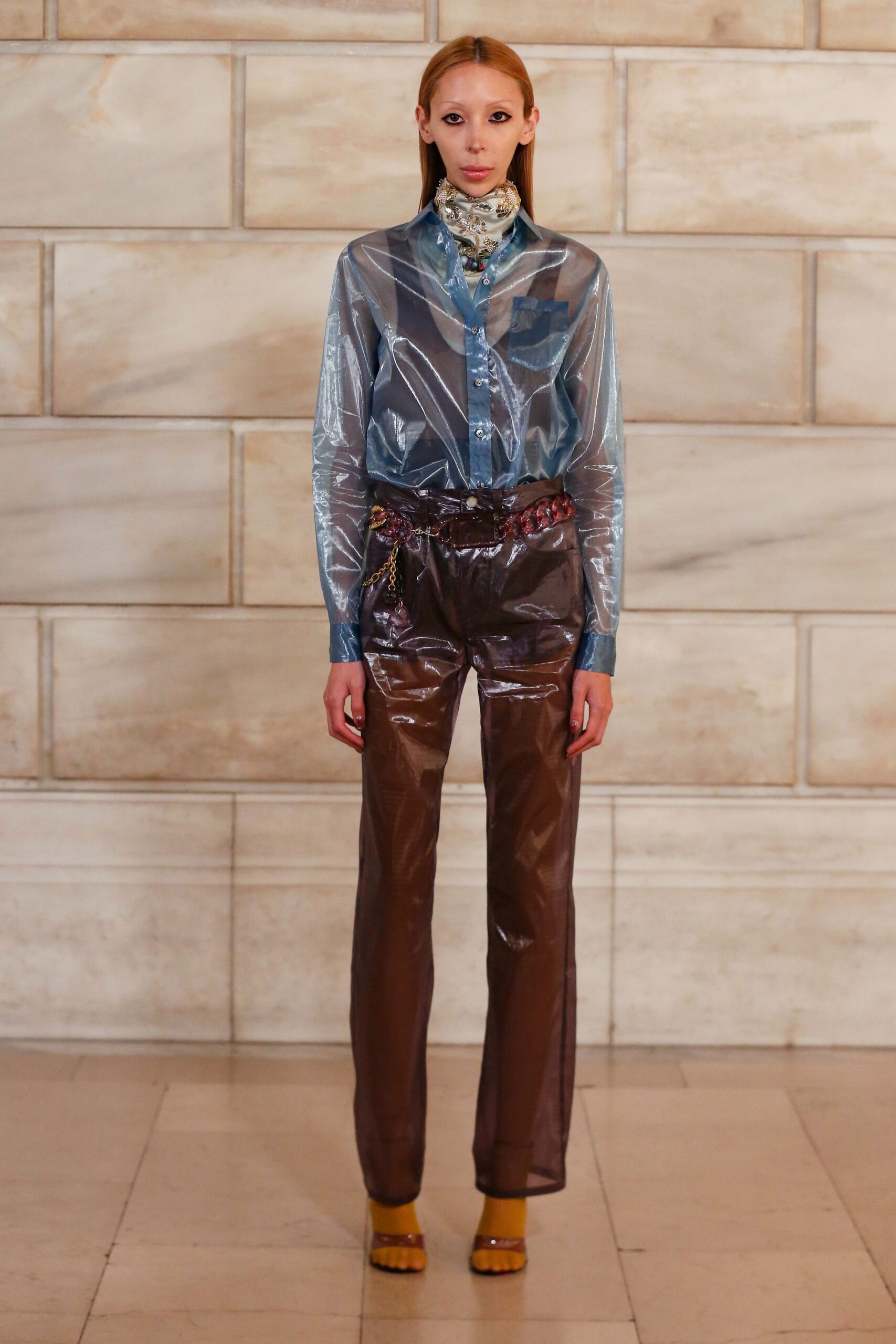 blue vinyl shirt with brown pants