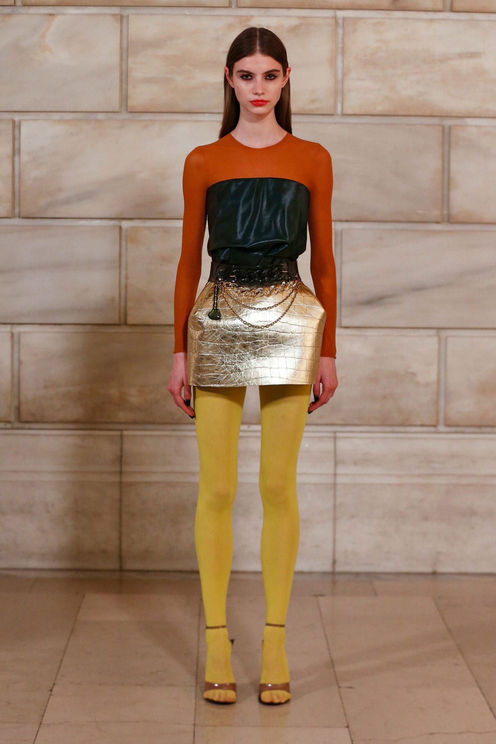 orange and green fitted top with gold skirt
