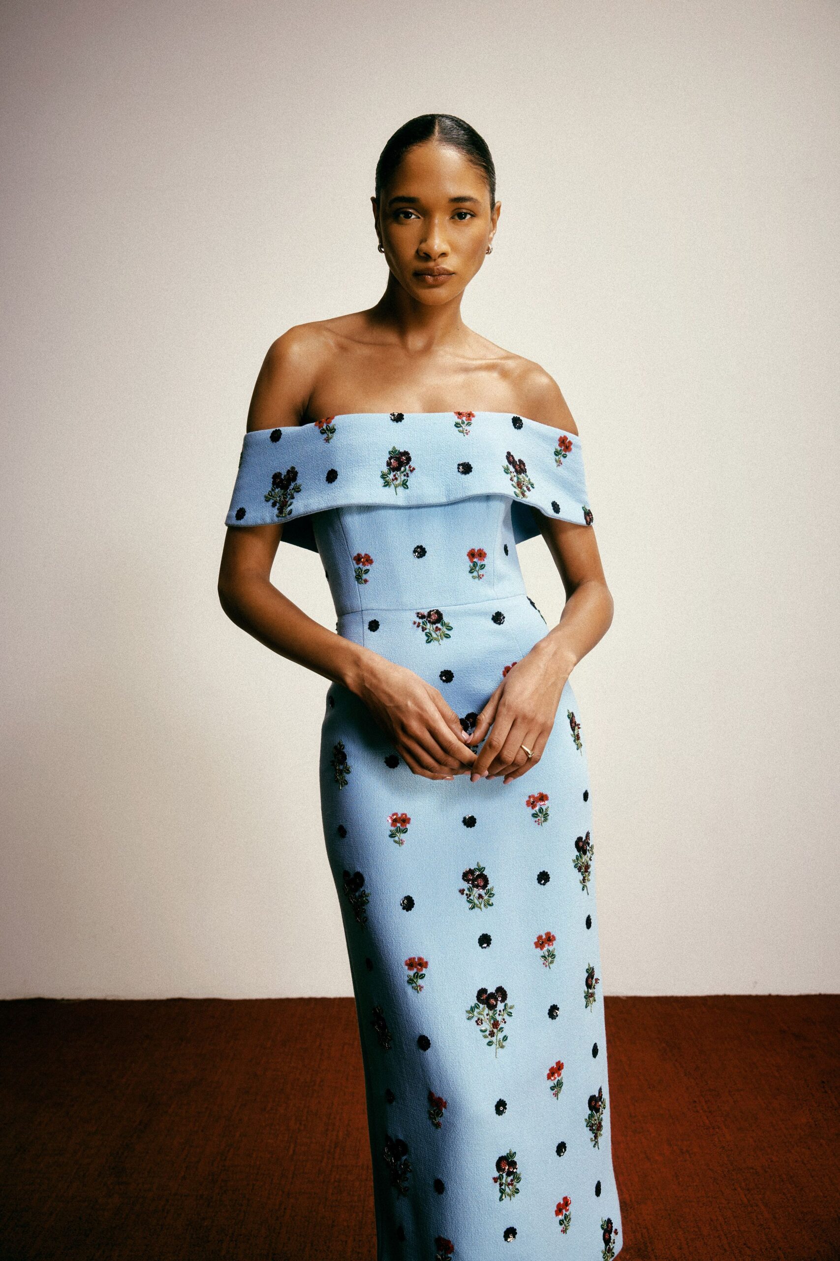 blue embroidered off-shoulder gown