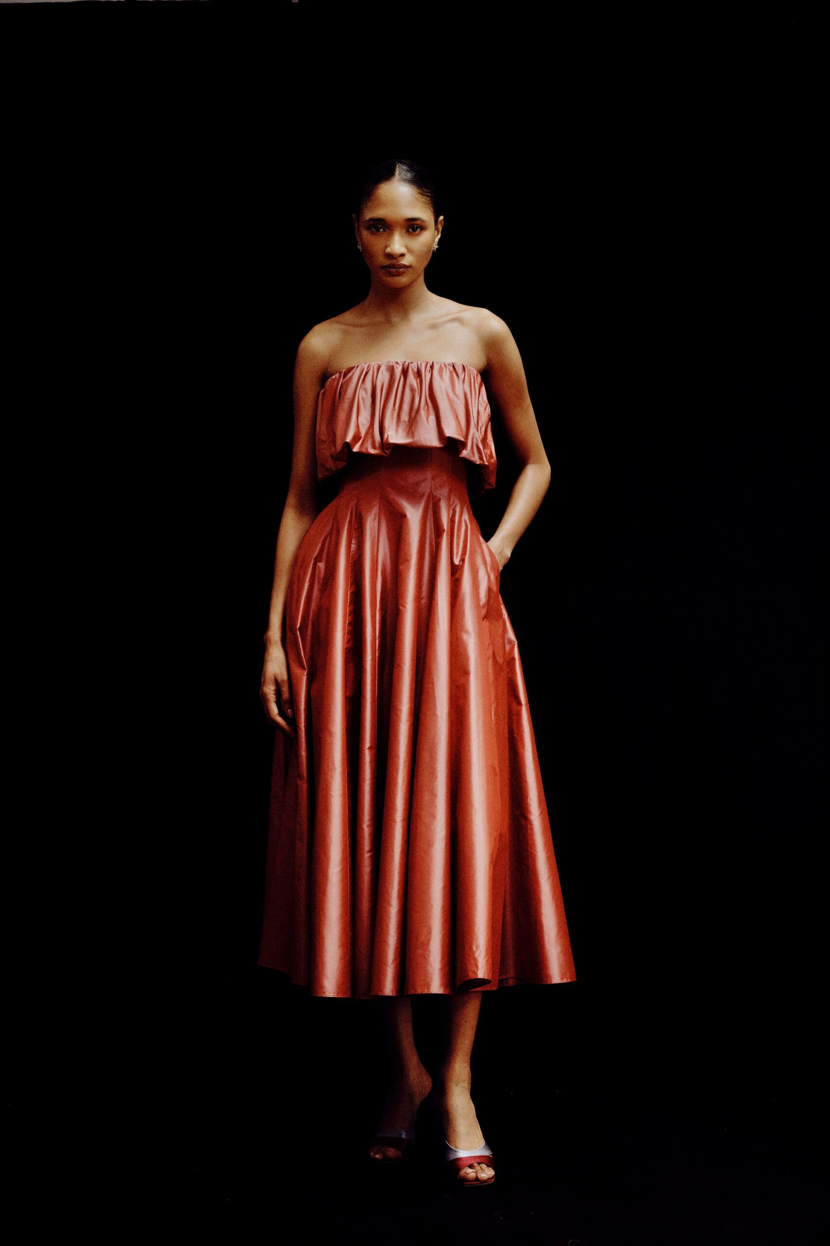 red silk sleeveless off-shoulder fitted pleated a-line dress
