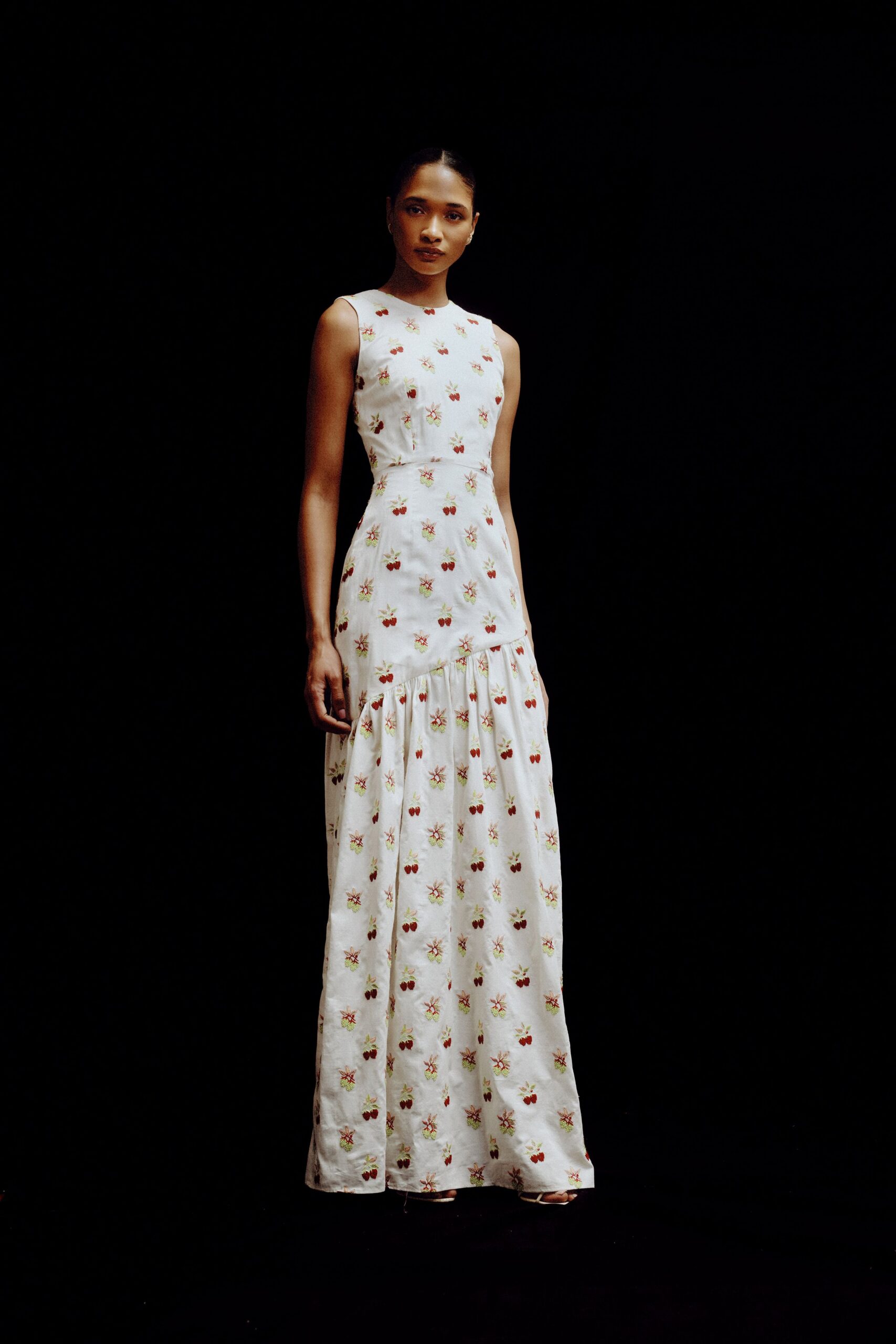 white embroidered sleeveless gown