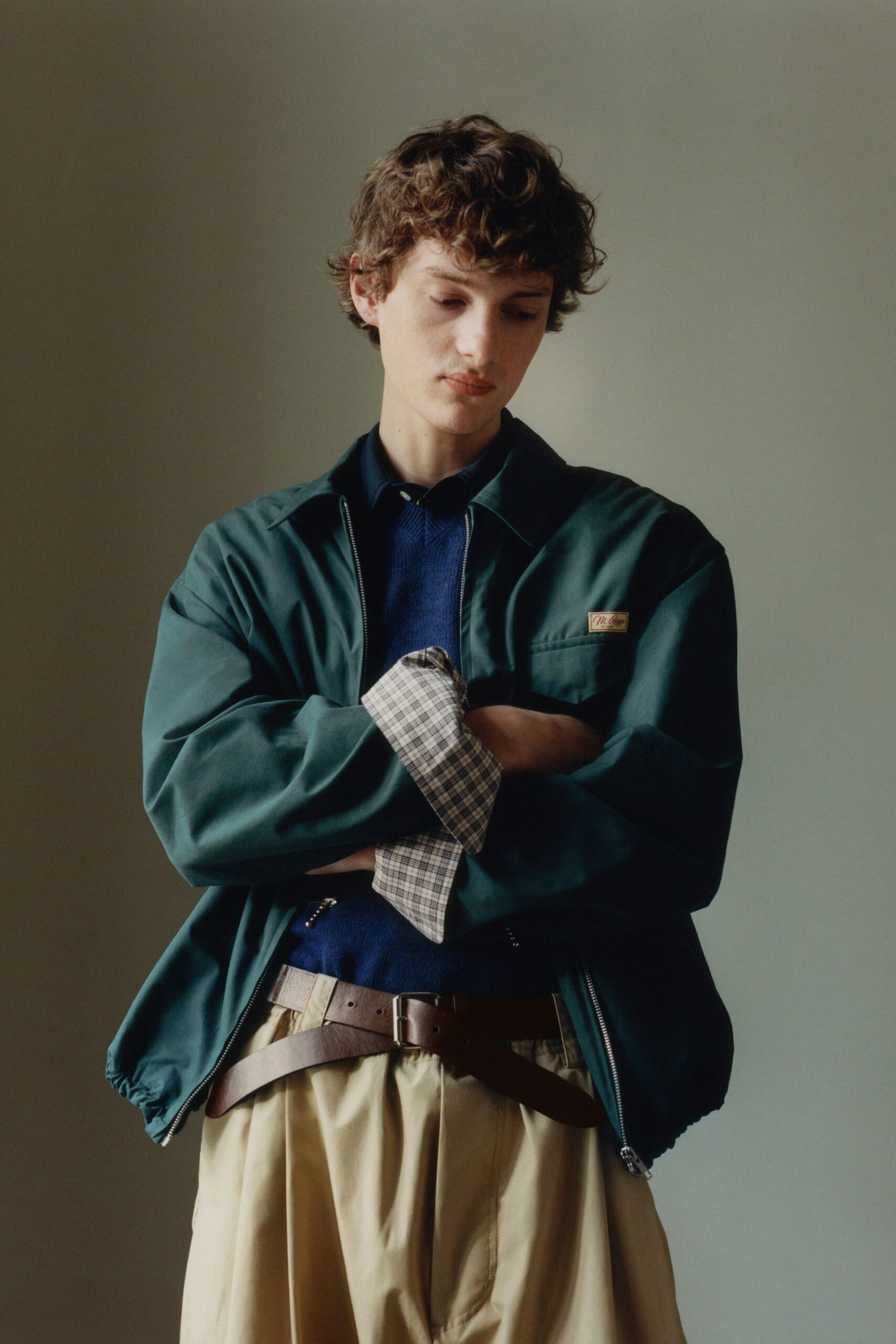 green relaxed jacket with beige pants