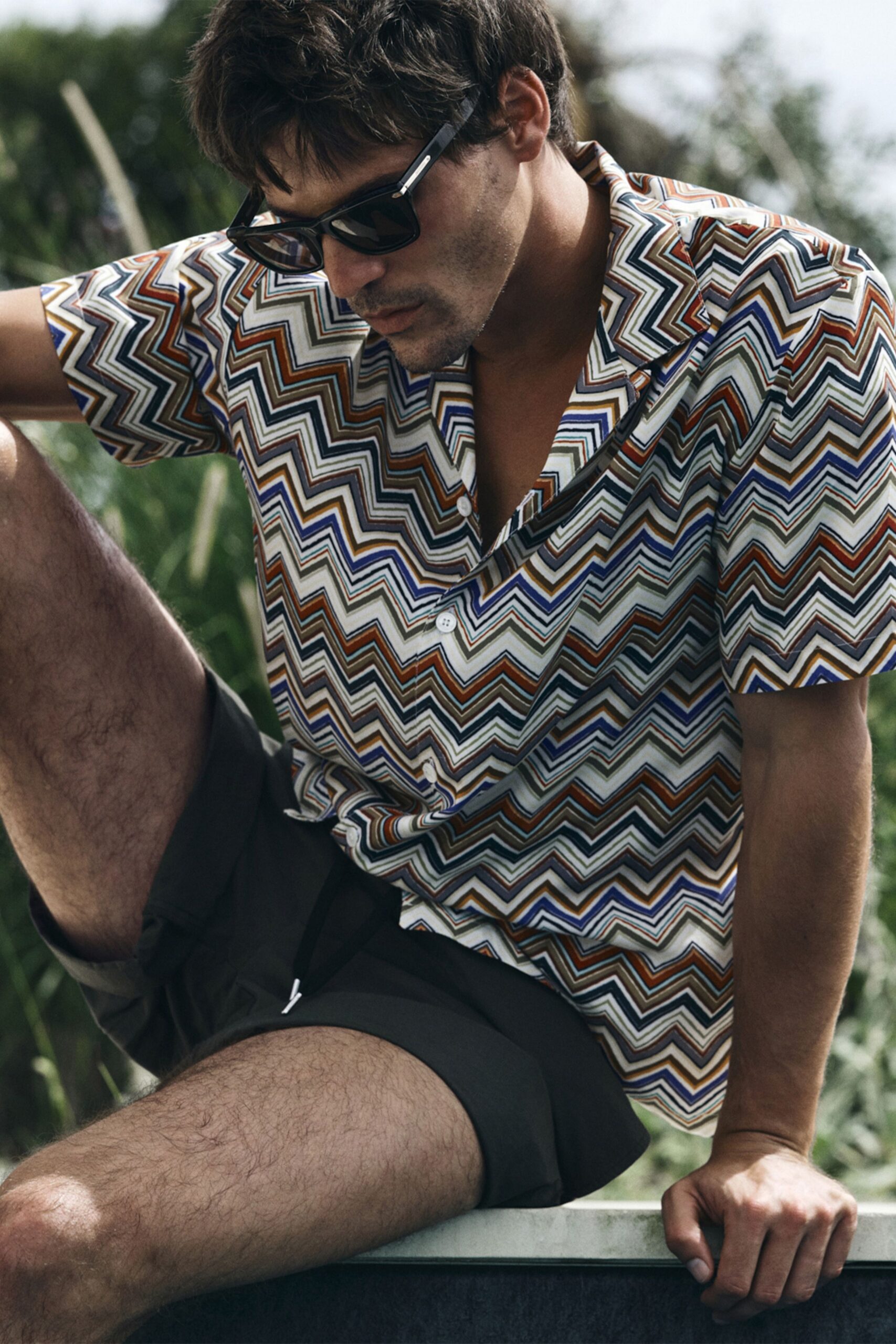 multi-colored zigzag shirt with gray shorts